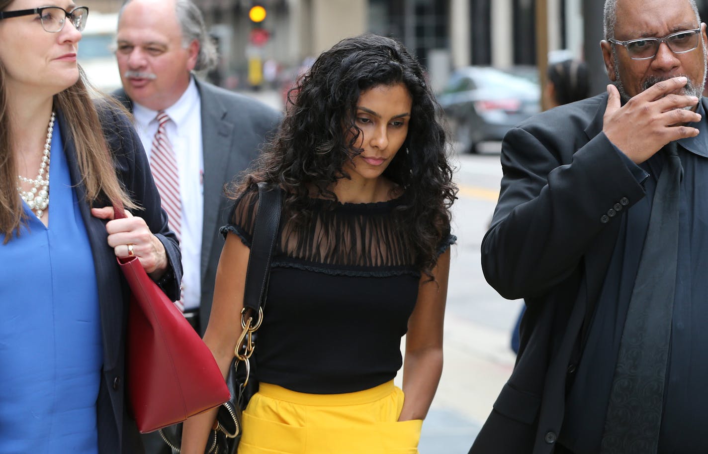 Manuela Testolini, Prince's ex-wife, center, leaves after the court hearing on whether or not to unseal the divorce file in Prince's divorce from Testolini. ] MARK VANCLEAVE/STAR TRIBUNE, Aug. 4, 2016. Minneapolis, Minn.