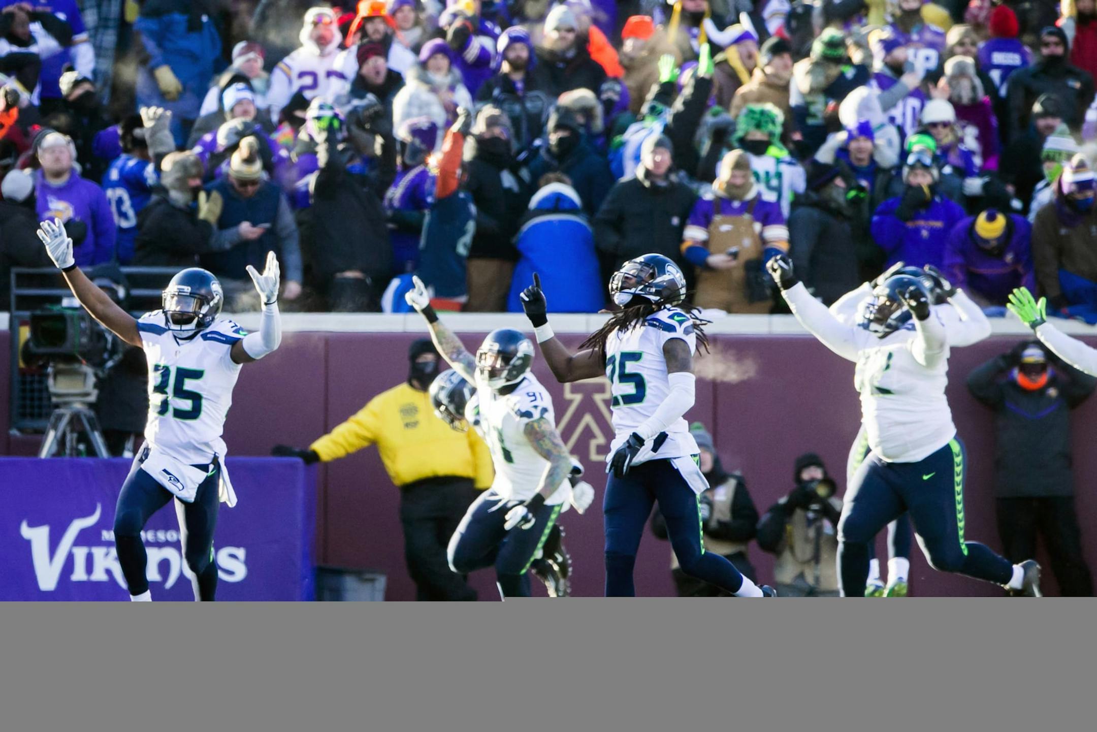 Seattle Seahawks cornerback Richard Sherman and teammates react after Minnesota Vikings kicker Blair Walsh missed a final field goal, sealing Seattle's 10-9 victory over Minnesota on Sunday, Jan. 10, 2016, at TCF Bank Stadium in Minneapolis. (Bettina Hansen/Seattle Times/TNS)