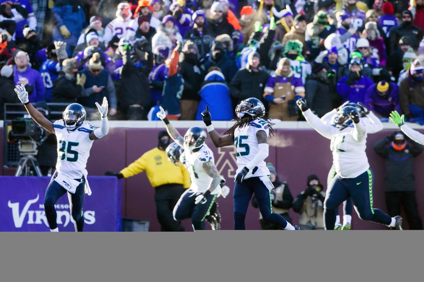 Seattle Seahawks cornerback Richard Sherman and teammates react after Minnesota Vikings kicker Blair Walsh missed a final field goal, sealing Seattle's 10-9 victory over Minnesota on Sunday, Jan. 10, 2016, at TCF Bank Stadium in Minneapolis. (Bettina Hansen/Seattle Times/TNS)