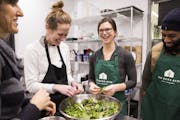 Dr. Kate Shafto and students Gretchen Klefstad, McKenna Campbell-Potter and Leo Howard prepared greens in a Food Matters for Health Professionals clas
