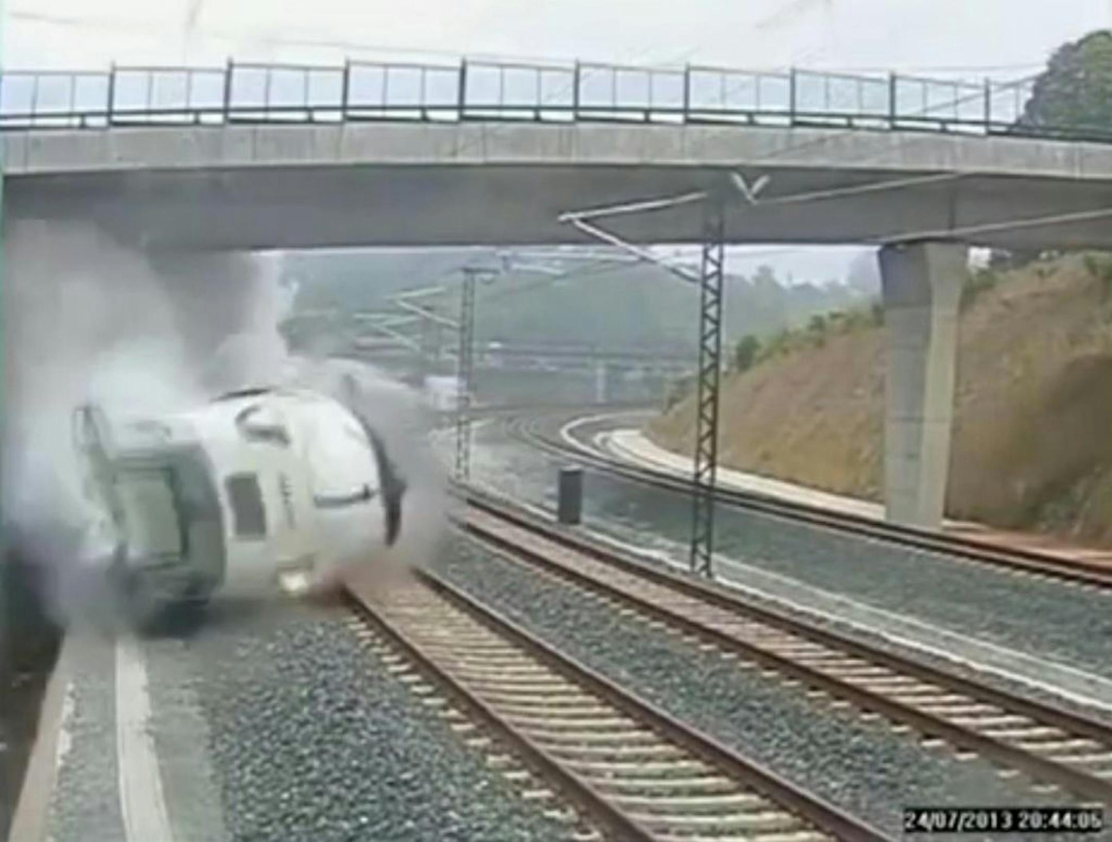 This image taken from security camera video shows a train derailing in Santiago de Compostela, Spain, on Thursday July 25, 2013.