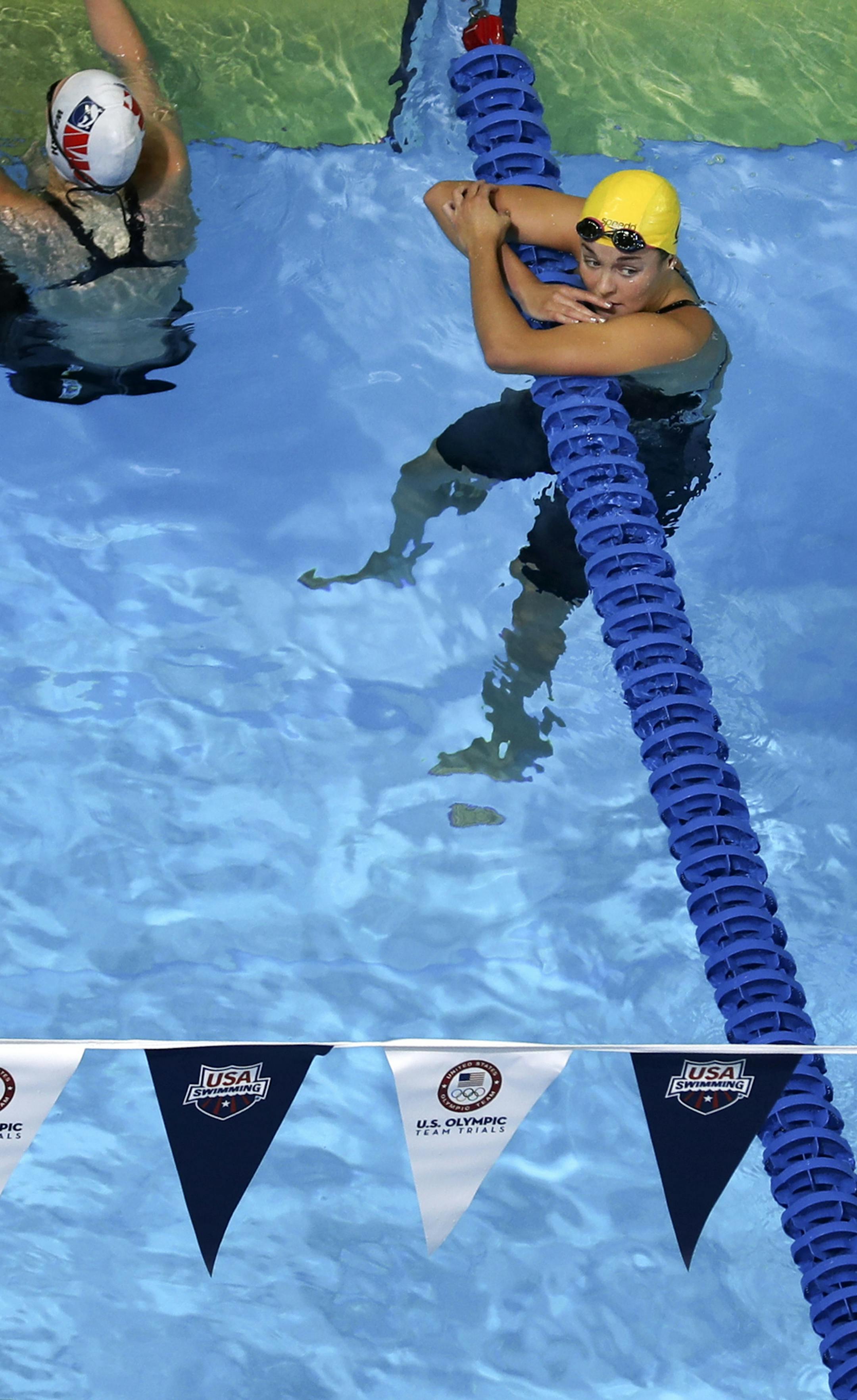 DAY 2 of the 2016 U.S. Olympic Swimming Trials got underway Monday morning with Minnesota's David Plummer and 14-year-old Regan Smith advancing to the semi-finals tonight. 2012 Olympian Rachel Bootsma, 22, finished 18th in Monday morning’s preliminaries, missing the semifinals by .02 of a second. Here, Bootsma lingers in the pool a bit after her disappointing swim. ] 2016 U.S. Olympic Swimming Team Trials brian.peterson@startribune.com Omaha, NE - 06/27/2016
