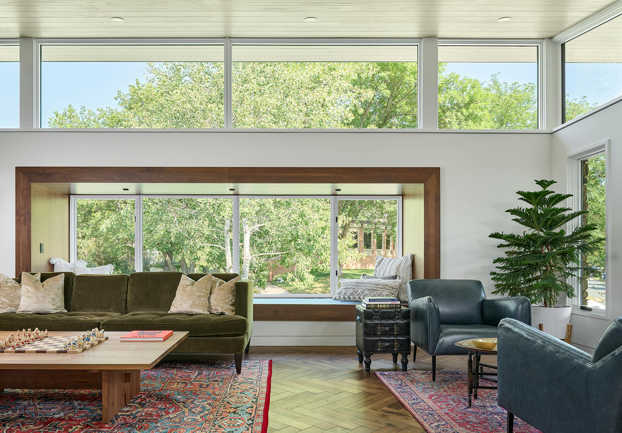After a fire forced a remodel of a St. Louis Park home, a family hoped for a footprint similar to their original single-story ranch-style house. At the same time, they were game for introducing new, bold and unique materials and design features such as soaring rooflines and transom windows that allow light to come in and display the family's vast plant collection like never before.