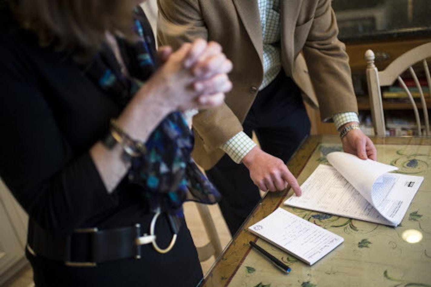 Real estate agent Chad Larsen went through a seller's property disclosure statement with Kate Helms during a meeting in her dining room Tuesday afternoon. The statement lists possible issues with the home, large and small, that she would need to disclose to potential buyers. ] (AARON LAVINSKY/STAR TRIBUNE) aaron.lavinsky@startribune.com 2015 was the third strongest year for house prices in the Twin Cities, but prices rose to record highs in several metro area communities during the year. Chad La