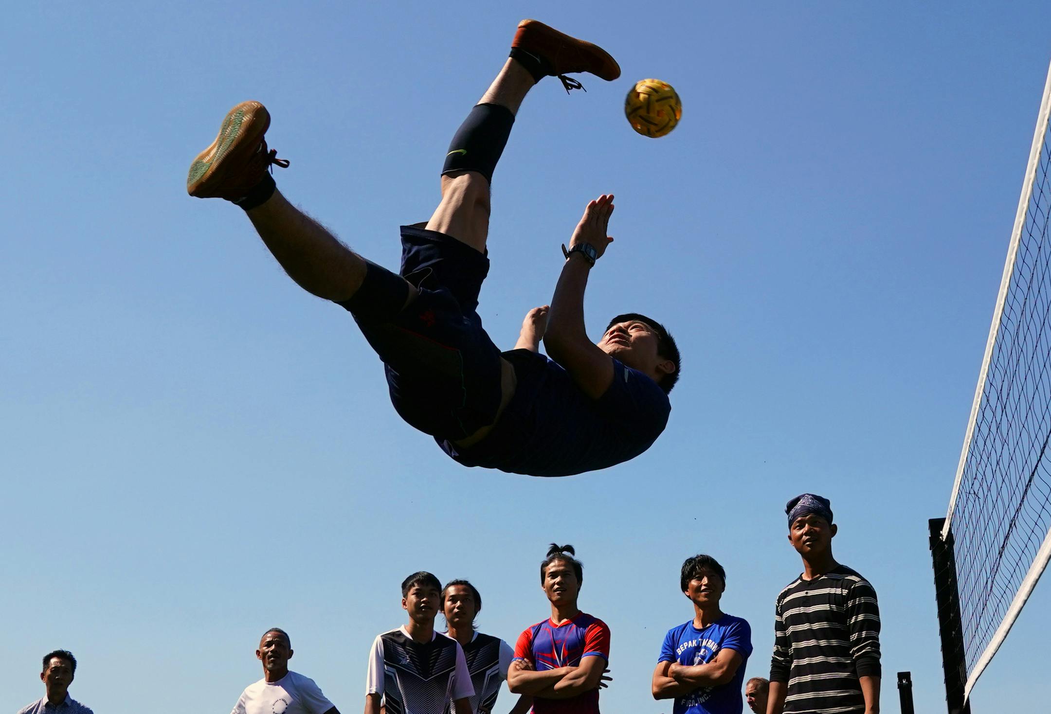 Kaw Ku demonstrated a spike in sepak takraw following the new courts dedication ceremony. ] ANTHONY SOUFFLE &#xef; anthony.souffle@startribune.com Officials held a ceremony to open new sepak takraw courts Saturday, Sept. 8, 2018 at the Duluth and Case Recreation Center in St. Paul, Minn. Sepak takraw is a sport that originated in Southeast Asia, similar to volleyball, but uses a woven ball. Players use only their feet, knee, chest and head, not their hands, to pass and hit the ball. State Sen. F