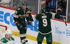 The Wild's Zach Parise celebrated with teammate Mikko Koivu after Parise's third-period goal against the Dallas Stars on Sunday.