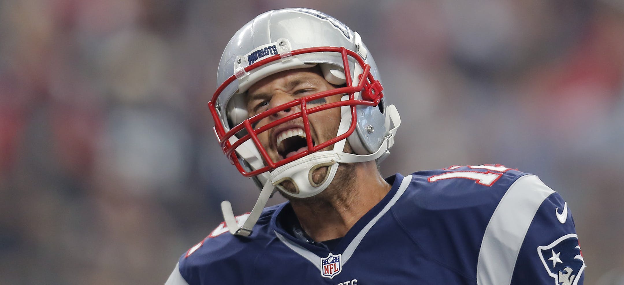 New England Patriots' Tom Brady celebrates after he scored on a 1-yard run against the Dallas Cowboys during the first half of an NFL football game, Sunday, Oct. 11, 2015, in Arlington, Texas. (AP Photo/Brandon Wade)
