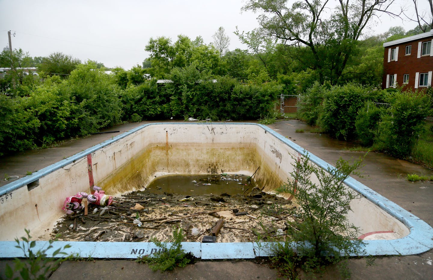 Monday where firefighters pulled two brothers from this abandoned swimming pool and seen Tuesday, May 26, 2015, in St. Paul, MN.](DAVID JOLES/STARTRIBUNE)djoles@startribune.com A young boy was in critical condition Monday after firefighters pulled him and his brother from about 6 feet of filthy water in an abandoned swimming pool in St. Paul. The boys, both believed to be younger than 10, were taken to area hospitals. The older boy is expected to recover fully, but the younger brother was in cri