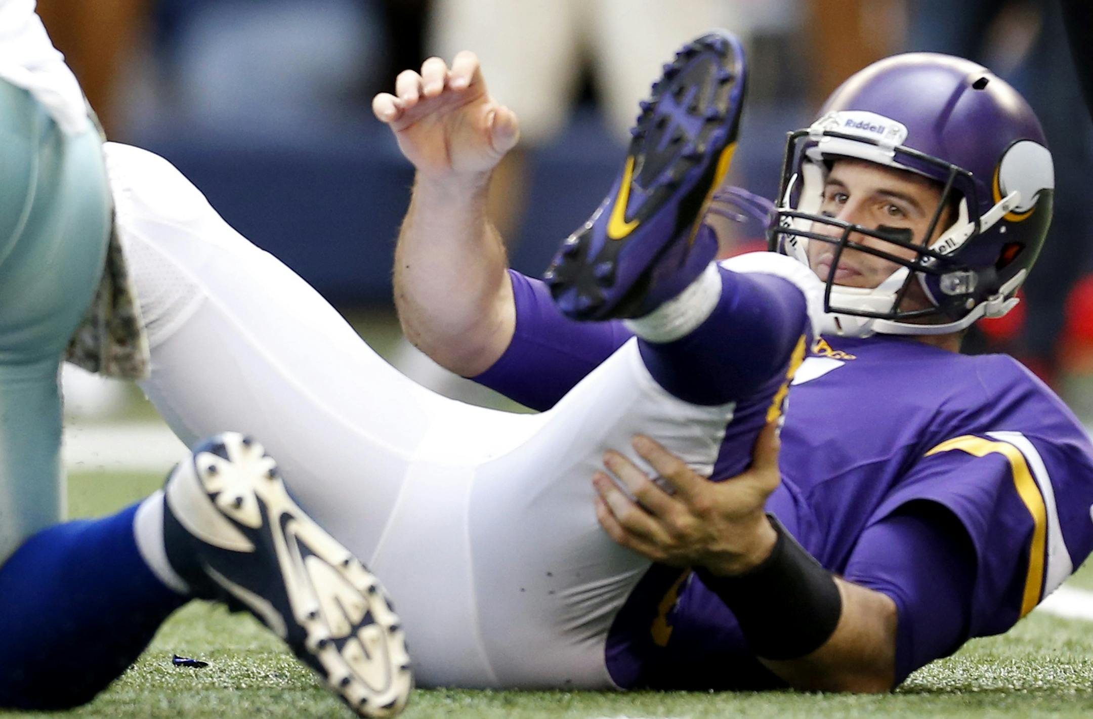 Vikings quarterback Christian Ponder (7) sat on the turf after throwing an interception in the fourth quarter. Dallas beat Minnesota by a final score of 27-23. ] CARLOS GONZALEZ cgonzalez@startribune.com November 3, 2013, NFL, Arlington, TX, AT&T Stadium, Minnesota Vikings vs. Dallas Cowboys