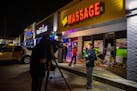 Reporters outside Young’s Asian Massage in Acworth, Ga., on March 18, 2021. It was one of three massage businesses where eight people were killed an