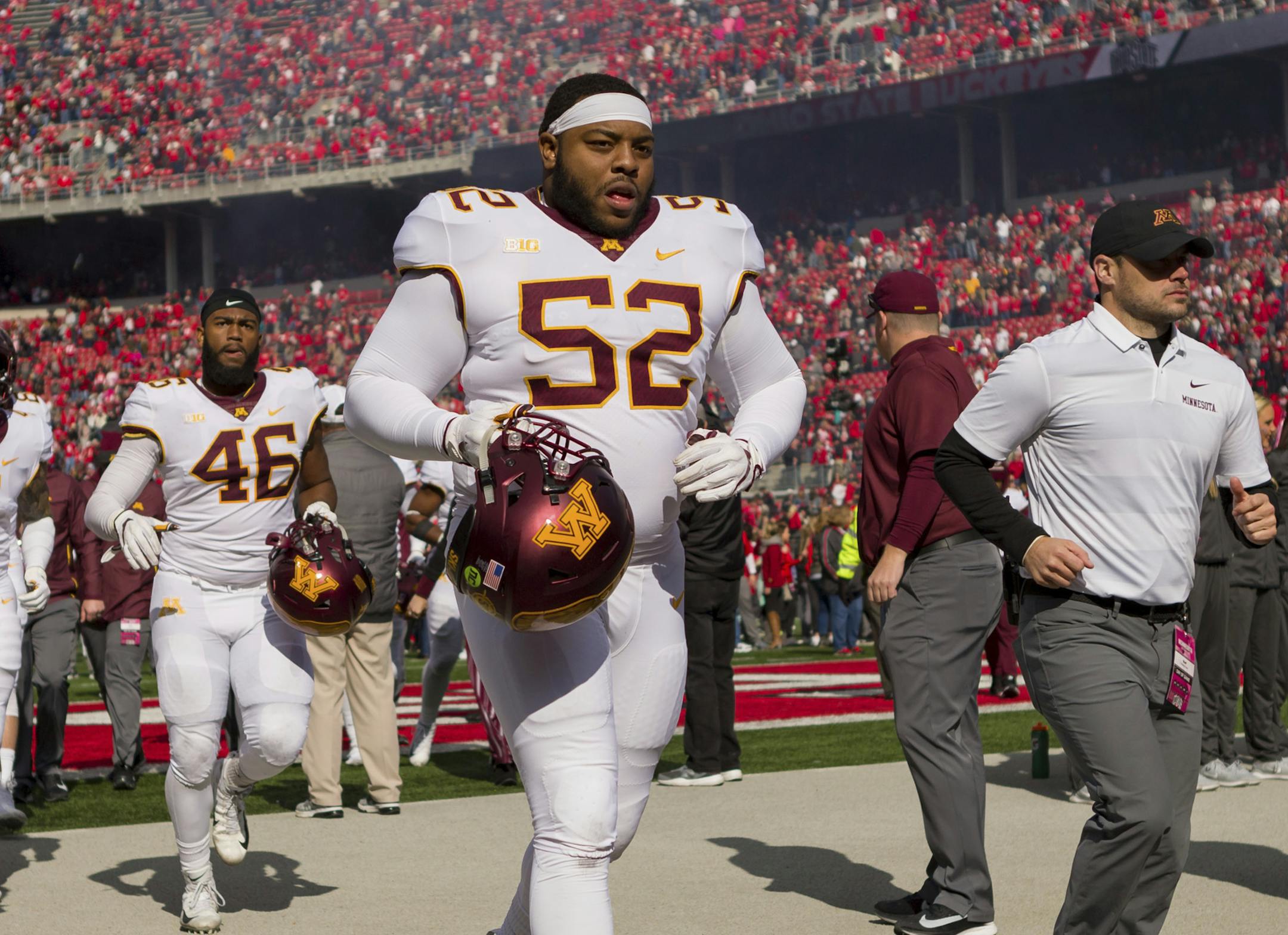 COLUMBUS, OH - OCTOBER 13: Minnesota Golden Gophers defensive lineman Jamaal Teague (52) and teammates jog off the field after losing a game between the Ohio State Buckeyes and the Minnesota Golden Gophers on October 13, 2018 at Ohio Stadium in Columbus, OH. The Buckeyes won 30-14. (Photo by Adam Lacy/Icon Sportswire) (Icon Sportswire via AP Images) ORG XMIT: 311954