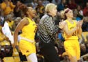 Minnesota head coach Marlene Stollings is fired up during a third quarter timeout last month, along with players Allina Starr (15) and Carlie Wagner (