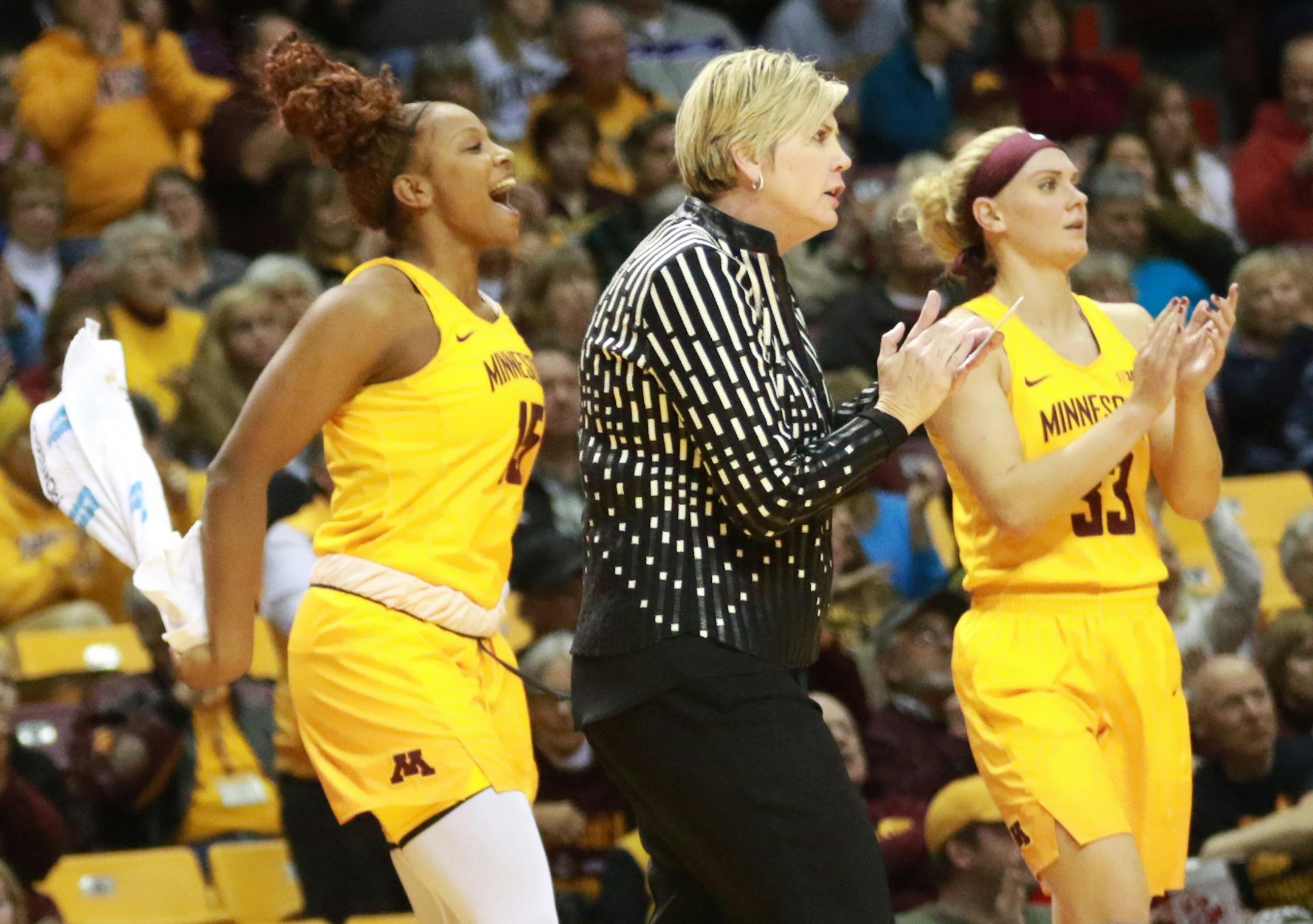 Minnesota head coach Marlene Stollings is fired up during a third quarter timeout last month, along with players Allina Starr (15) and Carlie Wagner (33).