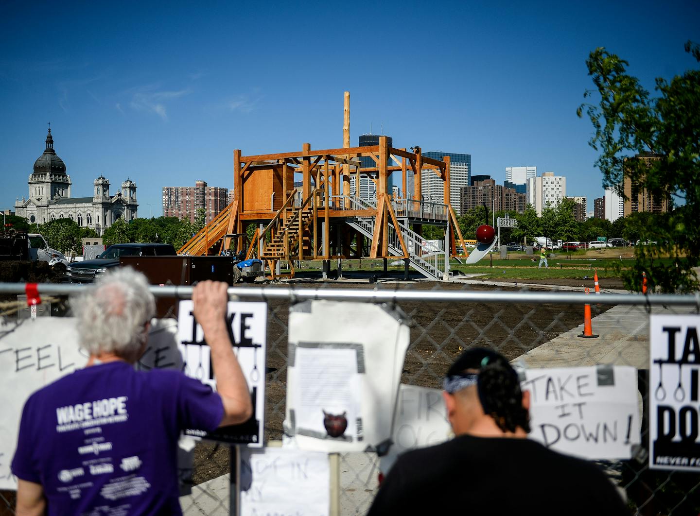 Patrick Greffin of Minneapolis, left, and Virgil Blacklance from the Lower Sioux Reservation visited the site of a protest near Sam Durant&#x2019;s &#x201c;Scaffold&#x201d; sculpture.