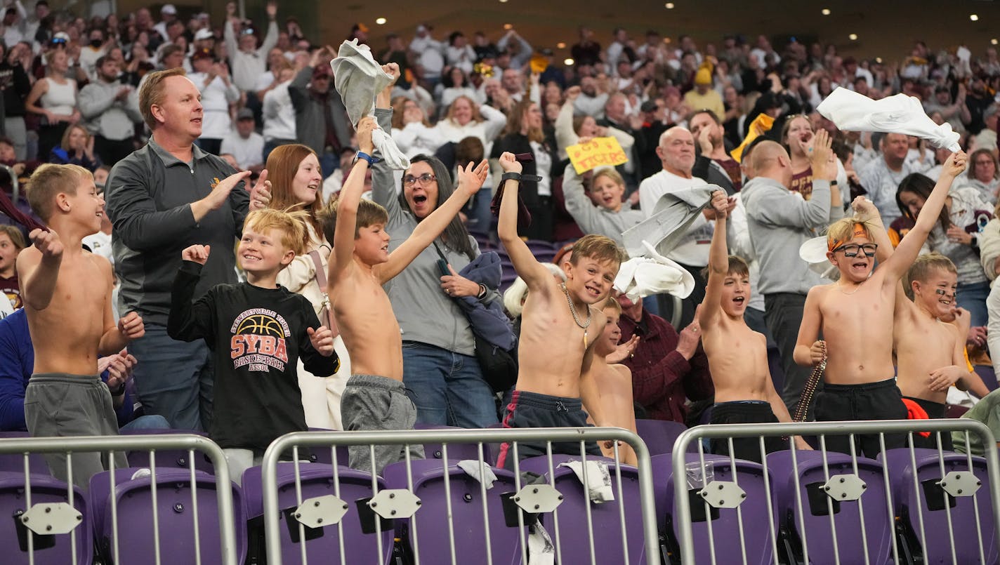 Young Stewartville fans cheer after the Tigers score a touchdown against Annandale in the state Class 3A championship football game at U.S. Bank Stadium in Minneapolis, Minn., on Saturday, Nov. 25, 2023. ] SHARI L. GROSS • shari.gross@startribune.com