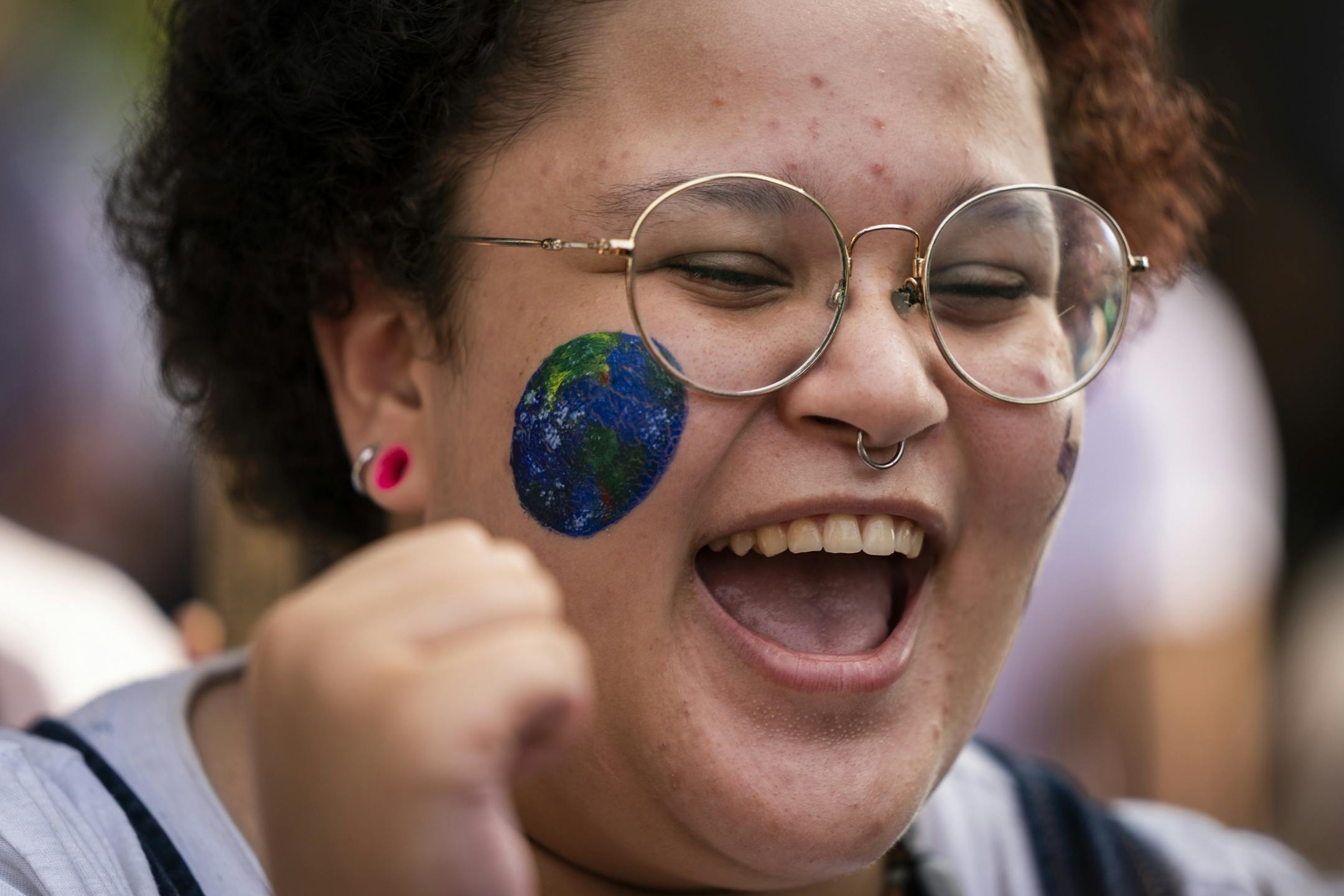 Orion Cook, 17, of Minneapolis chanted at Western Sculpture Park before the march to the Capitol.