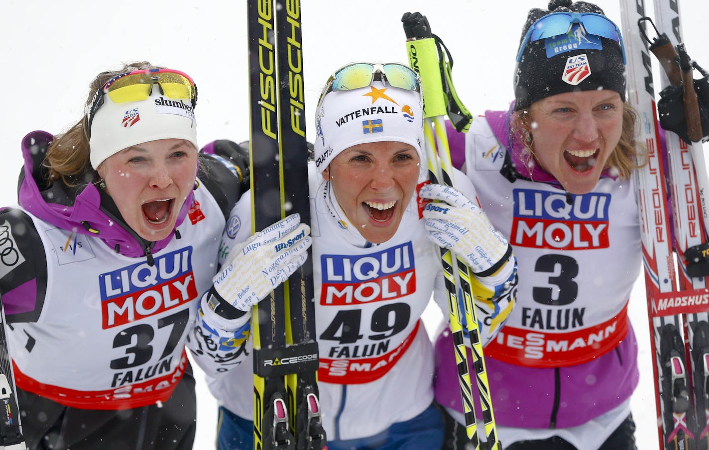 Winner Sweden's Charlotte Kalla, center, celebrates besides second placed United States' Jessica Diggins, left, and third placed United States' Caitlin Gregg after the 10 km Individual competition at the Nordic Skiing World Championships in Falun, Sweden, Tuesday, Feb. 24, 2015. (AP Photo/Matthias Schrader)