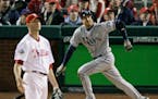 Rocco Baldelli watches his solo home run off Phillies relief pitcher Ryan Madson during the seventh inning of Game 5 of the 2008 World Series