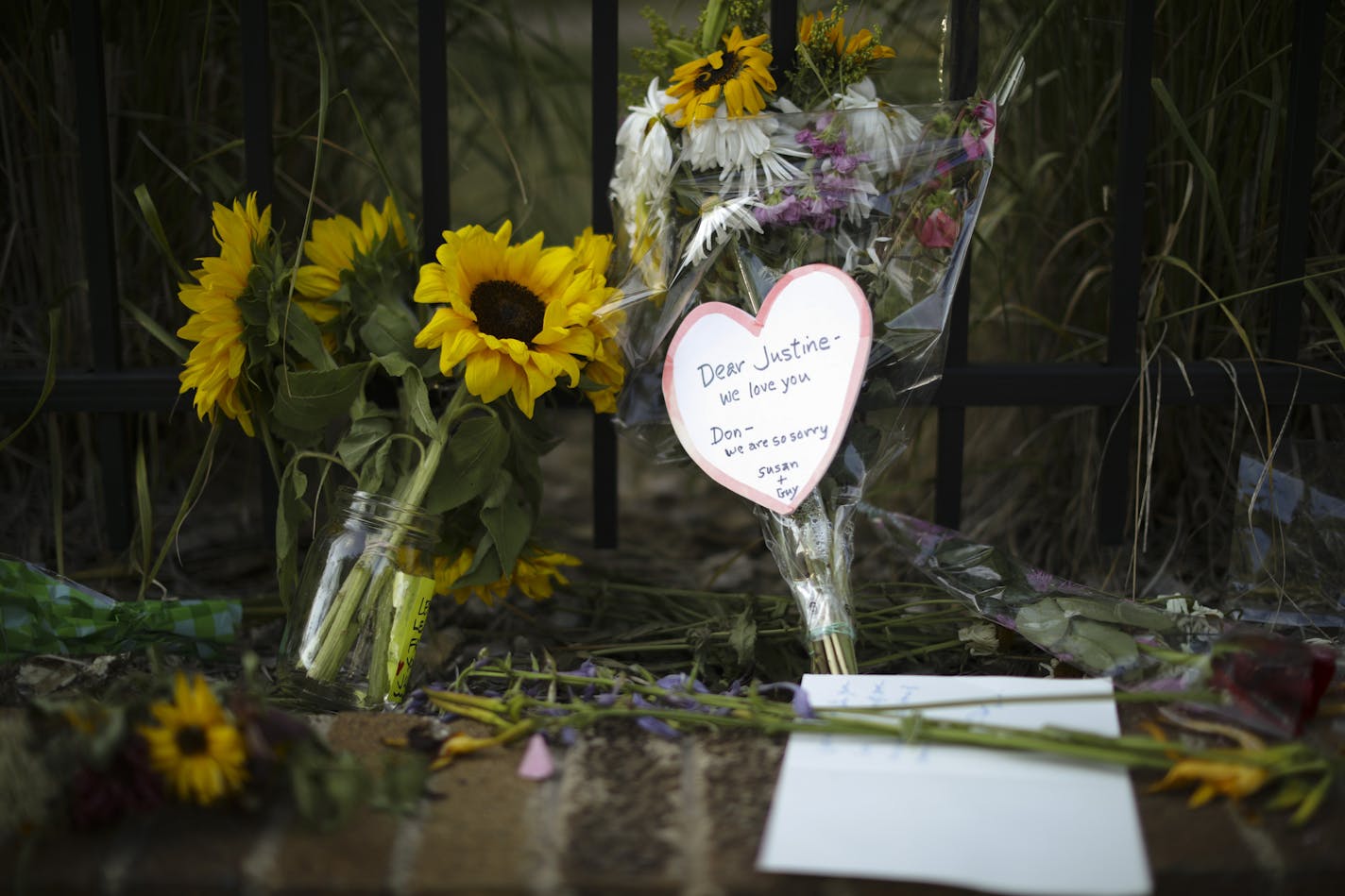 Detail of the larger memorial on the sidewalk on W. 51st. St. in the Fulton neighborhood Monday night. ] JEFF WHEELER &#xef; jeff.wheeler@startribune.com Friends and strangers continue to stop at the spot on W. 51st St. where a memorial is slowly growing for Justine Damond Monday night, July 17, 2017 in Minneapolis.