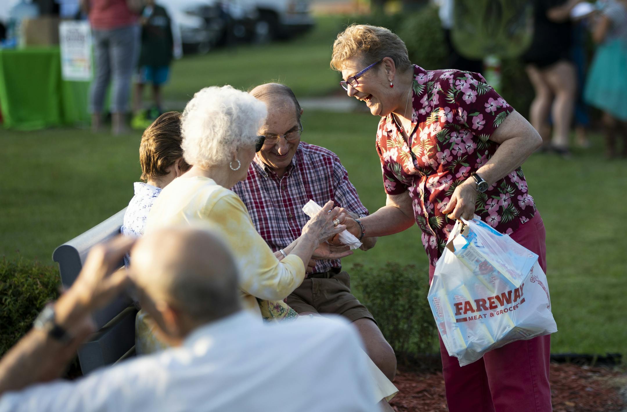 "When's the last time you had a popsicle?" Joy Culpepper said as she handed out popsicles at a grand opening for the Virtues Trail in Faribault, Minn. on August 22, 2018. Faribault has launched a community-wide effort called the Virtues Project to help teach and incorporate virtues in everyday life -- in business, in schools, in sports. This was the grand opening of the Virtues Trail with mirrors with virtues written in three languages.