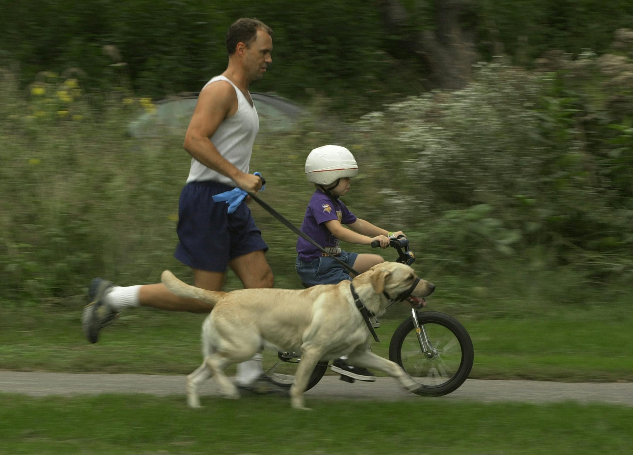 GENERAL INFORMATION: Minneapolis,Mn. Friday 9/19/2002 But even before the recommendation came out Minneapolis firefighter Jim Hart and his wife, Stacie, made sure they got way more than an hour a day of exercise. ``To live an optimal life, you have to be in good physical condition,'' Jim Hart said. ``There nothing more important than your health. It's more important than money.'' After lifting weights for an hour a day, Hart rides his bike hard for a half-hour before his older son comes home from school. Then the entire family rides bikes, climbs the steep stairs at Lake Nokomis, exercises at the gym, and swims. Experts say that parents who exercise with their children are more likely to be fit and to produce fit kids. Jim has been running alongside his yougner son as the boy learns to ride his bike.Minn