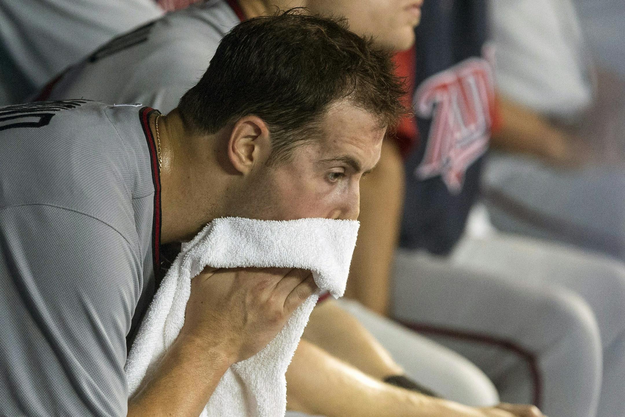 Minnesota Twins pitcher Scott Diamond sits in the dugout after being pulled from baseball game after giving up four runs to the Toronto Blue Jays during the fifth inning of AL baseball game action in Toronto, Sunday July 7, 2013. (AP Photo/The Canadian Press)