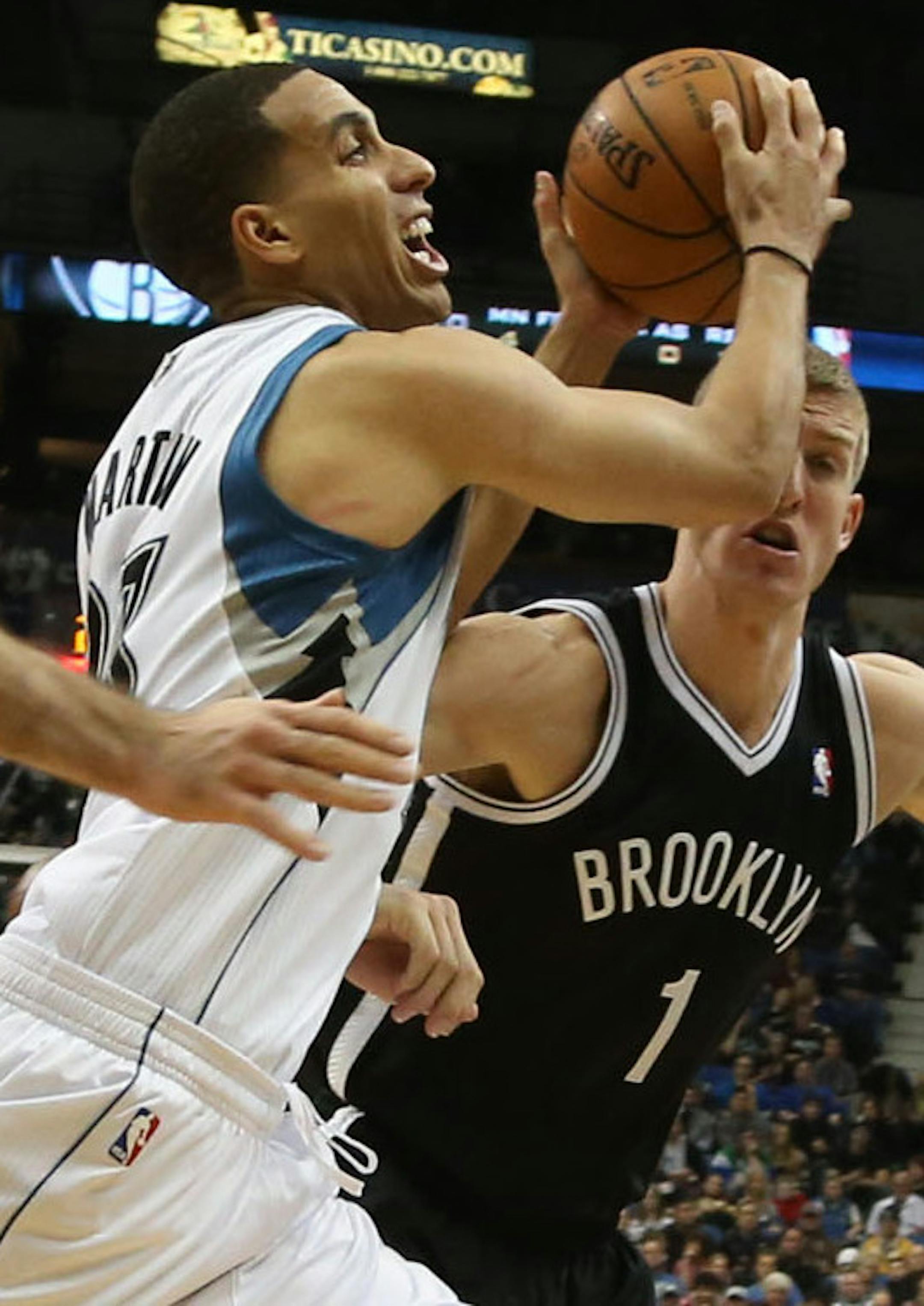 Wolves Kevin Martin split the two Nets defenders Tornike Shengelia and Mason Plumlee during the first half at the Target Center in Minneapolis, Friday, November 22, 2013. ] (KYNDELL HARKNESS/STAR TRIBUNE) kyndell.harkness@startribune.com