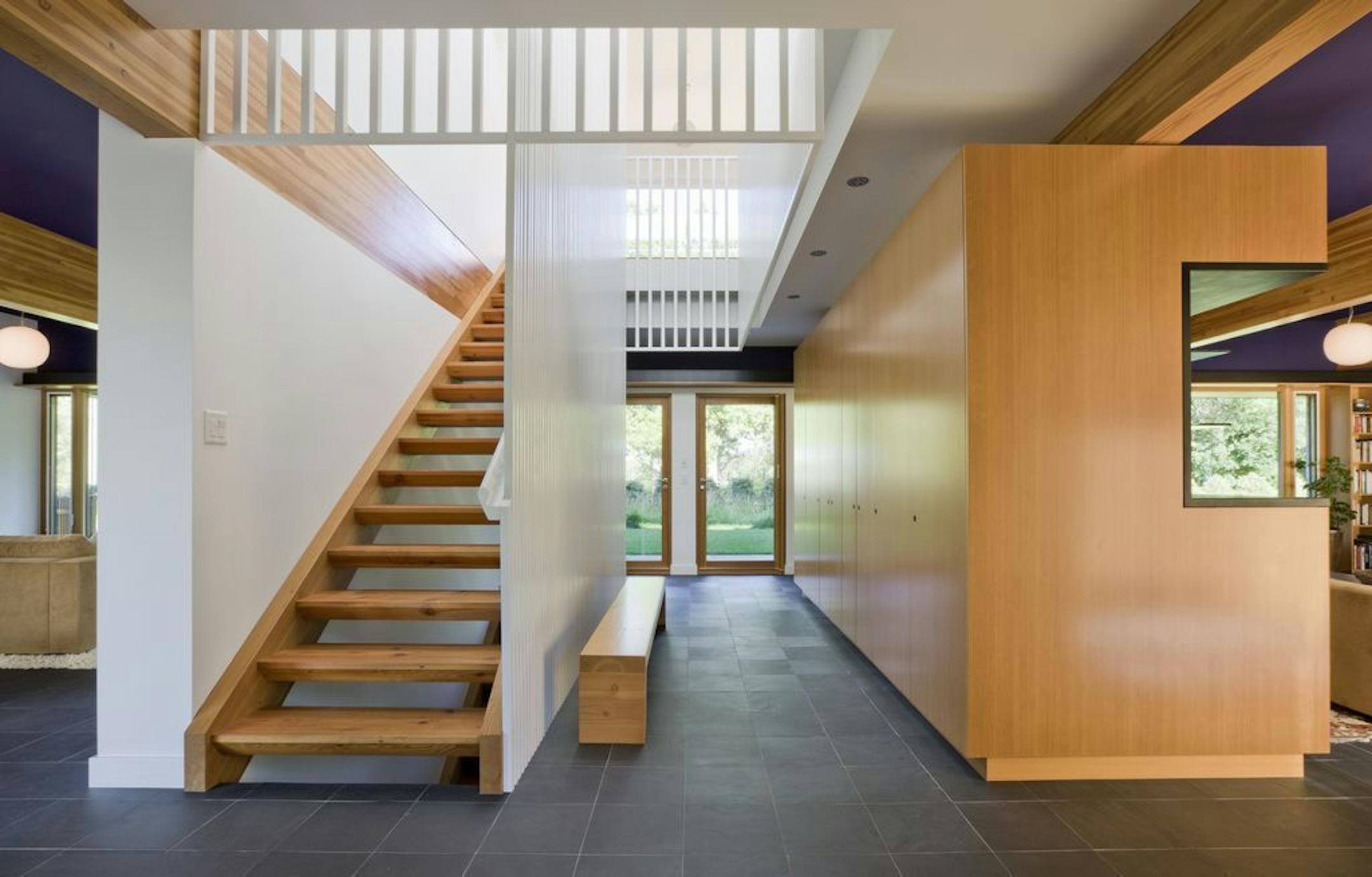 Reclaimed fir stairs and heated slate floor tile on the main level.