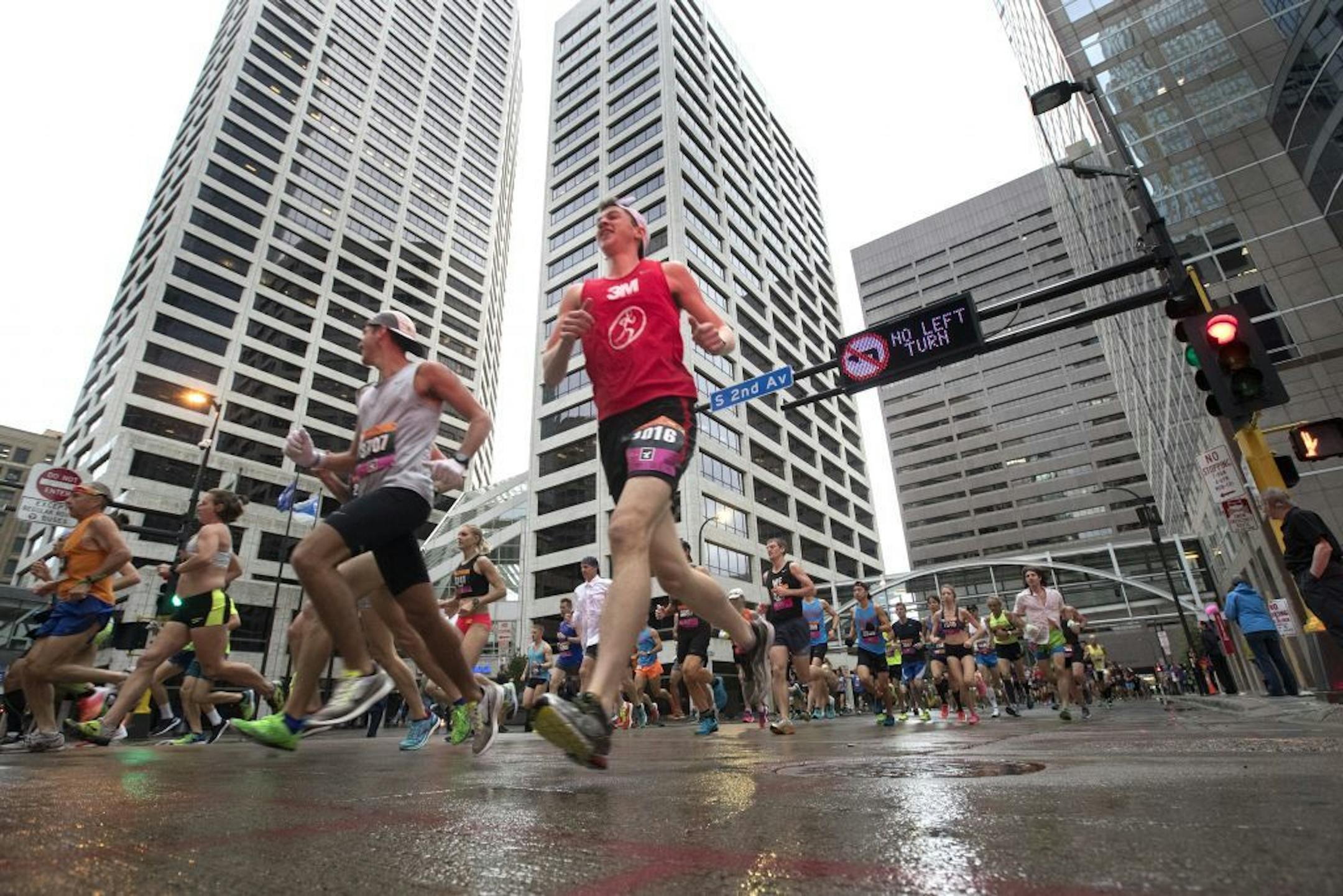 Runners make there way though downtown Minneapolis at the the start of the Twins Cities Marathon Sunday October 1,2017 in Minneapolis, MN.