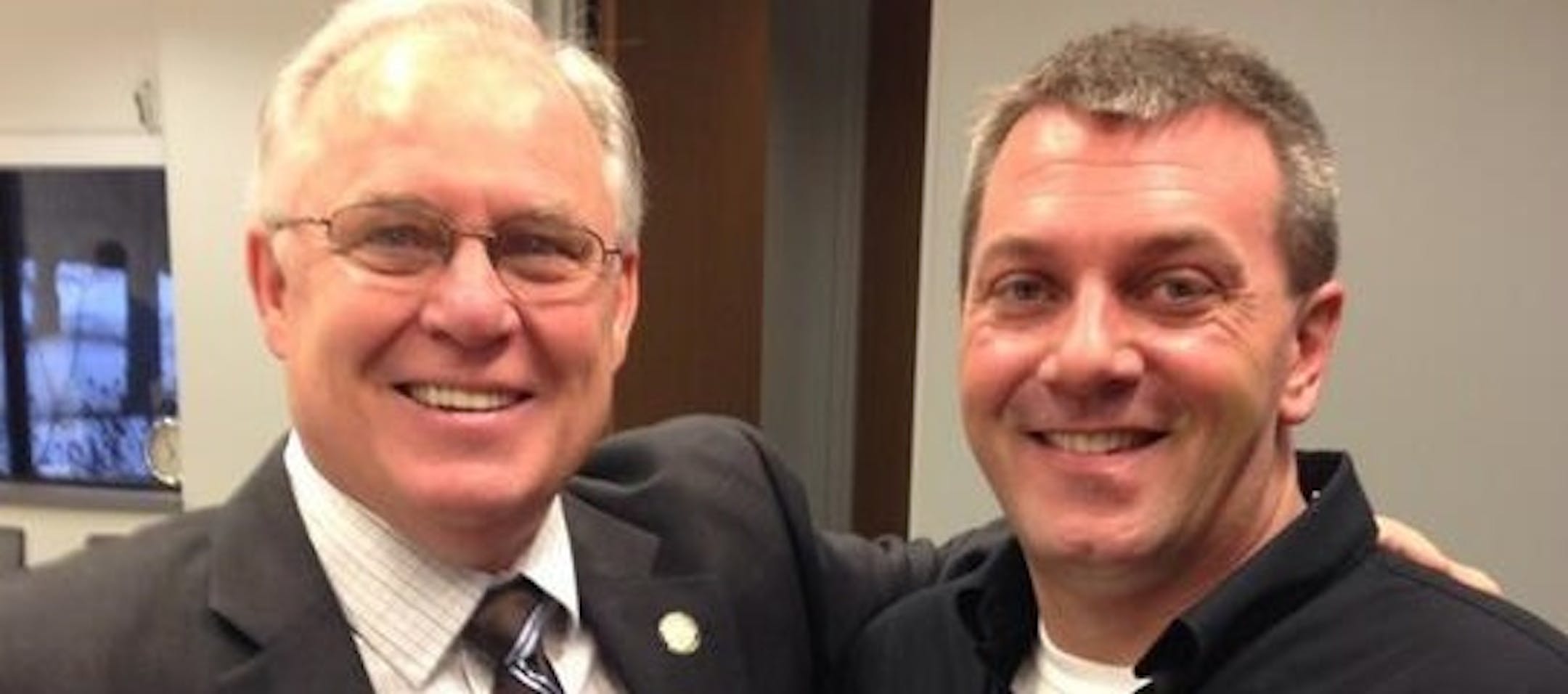 Minnesota state Sen. Dan Hall meets with Joe Johnson at a Trust Vets meeting.