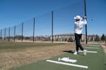 Jared Larson of Woodbury hit balls at the driving range at Ponds at Battle Creek golf course in Maplewood in April last year.