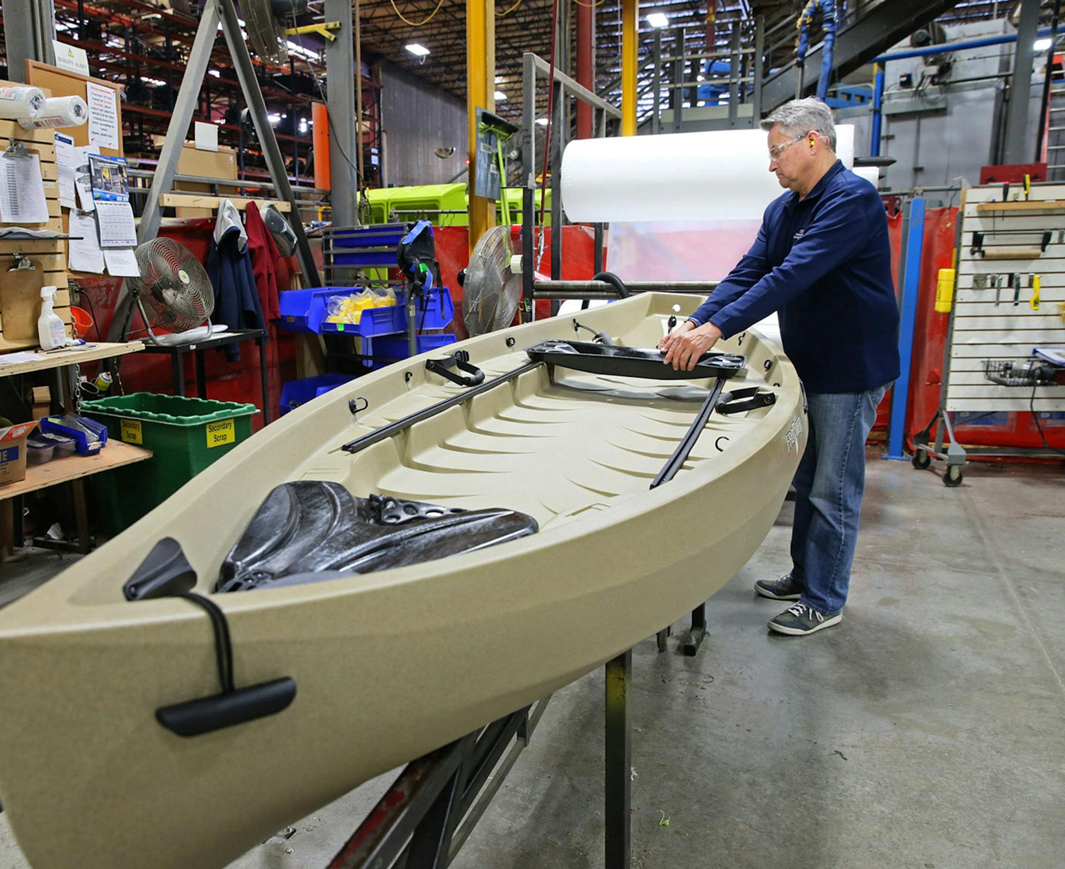 Daven Claerbout, Director of Business Development and one of the owners of Dutchland Plastics, checks over one of the kayaks they make for a client on Jan. 19, 2016 in Oostburg, Wis. (Michael Sears/Milwaukee Journal Sentinel/TNS) ORG XMIT: 1180149