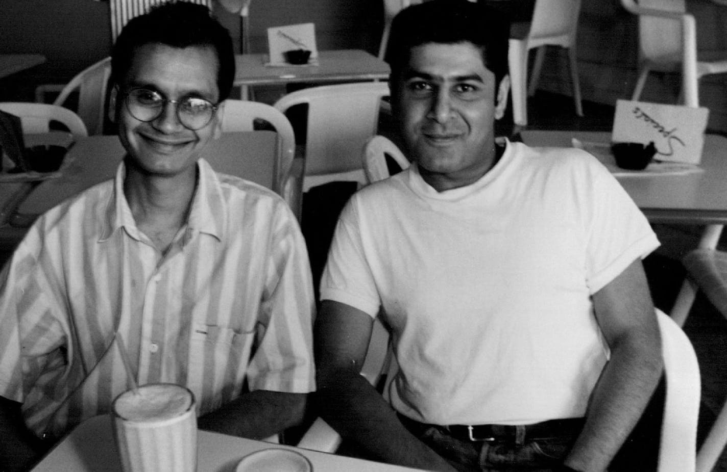 June 19, 1991 (left to right) Raghavan Iyer and Atul Kapoor, owners of the Cafe Moca with a lunch plate consisting of 602 lean hamburger, homemade Frys and mango shake. June 28, 1991 Bruce Bisping, Minneapolis Star Tribune