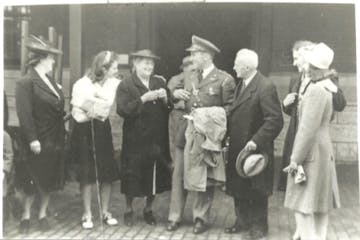 A uniformed Bill Bianchi surrounded by his mother and sisters, sometime around 1940. 