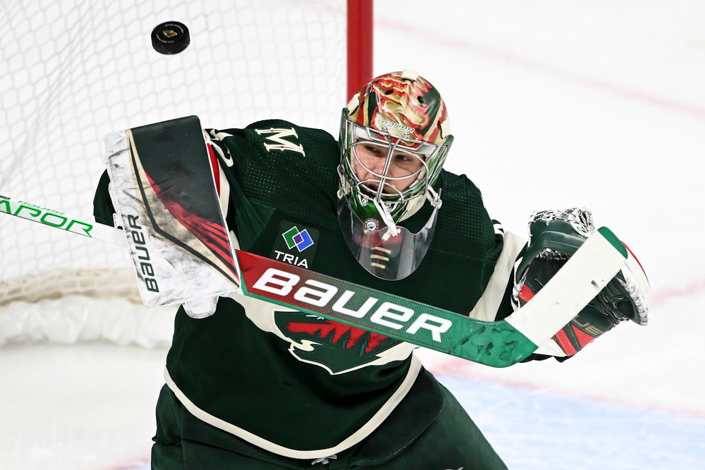 Minnesota Wild goaltender Filip Gustavsson (32) makes a save against Calgary Flames during the third period of an NHL hockey game Tuesday, March 7, 2023 at the Xcel Energy Center in St. Paul, Minn.. ] AARON LAVINSKY • aaron.lavinsky@startribune.com