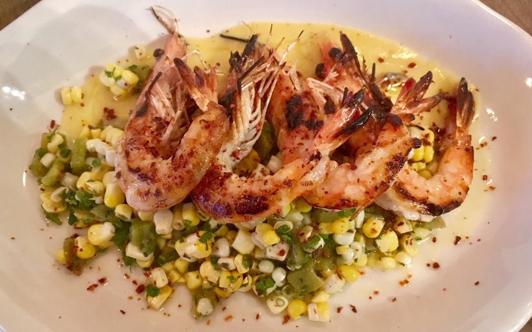 Roasted prawns with grilled peppers and sweet corn salsa from Hyacinth.