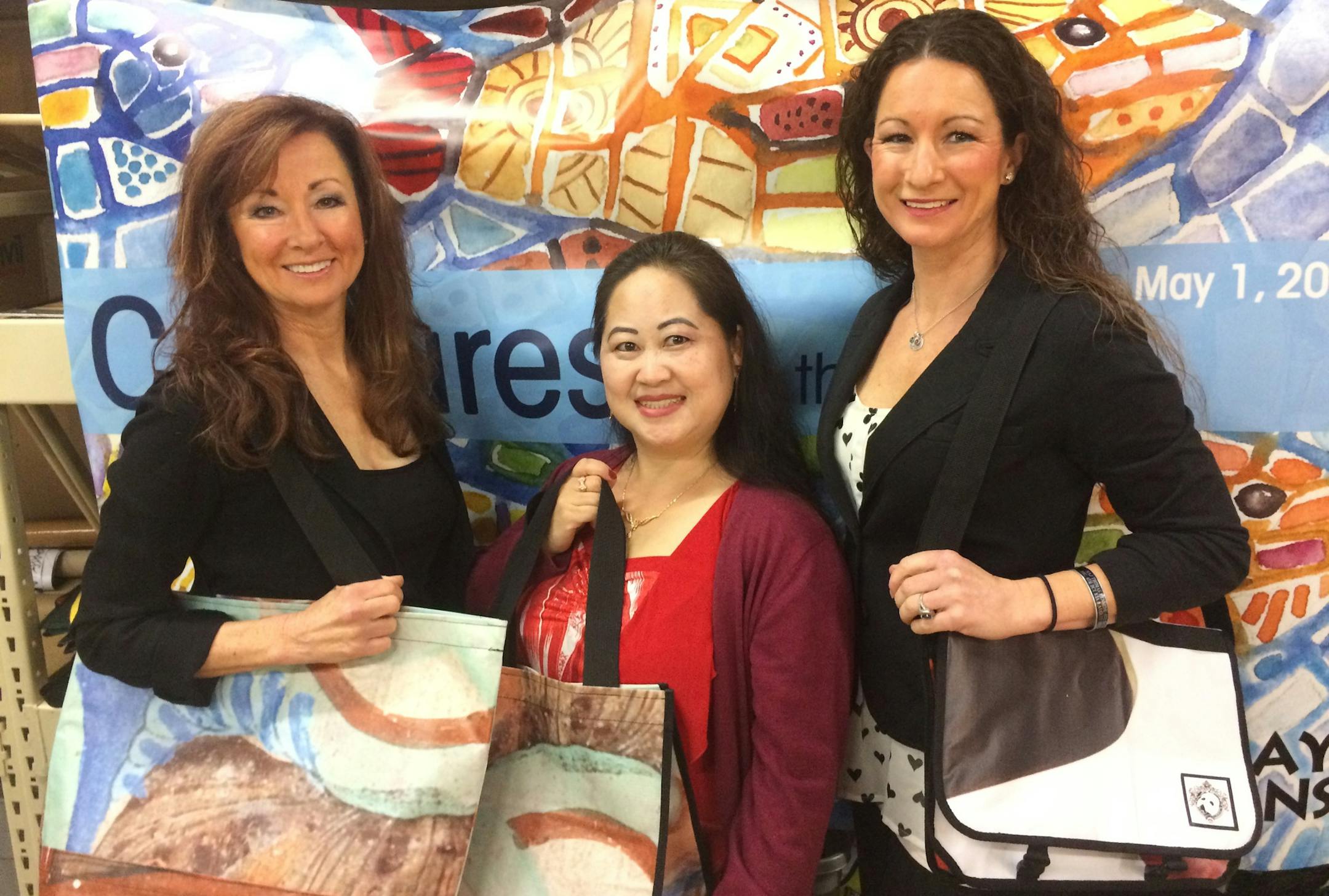 CEO Della Simpson, Pang Kou Her and Kari Brizus of Relan model reusable bags made from vinyl banners that are no longer headed for landfills by companies such as the Getty Museum and United Airlines. The banners are refrabicated into reusable bags, card holders and other products and and sold by Relan to the donor companies who sell them in their company stores or give them to stakeholders.
Photo: Neal.St.Anthony@startribune.com