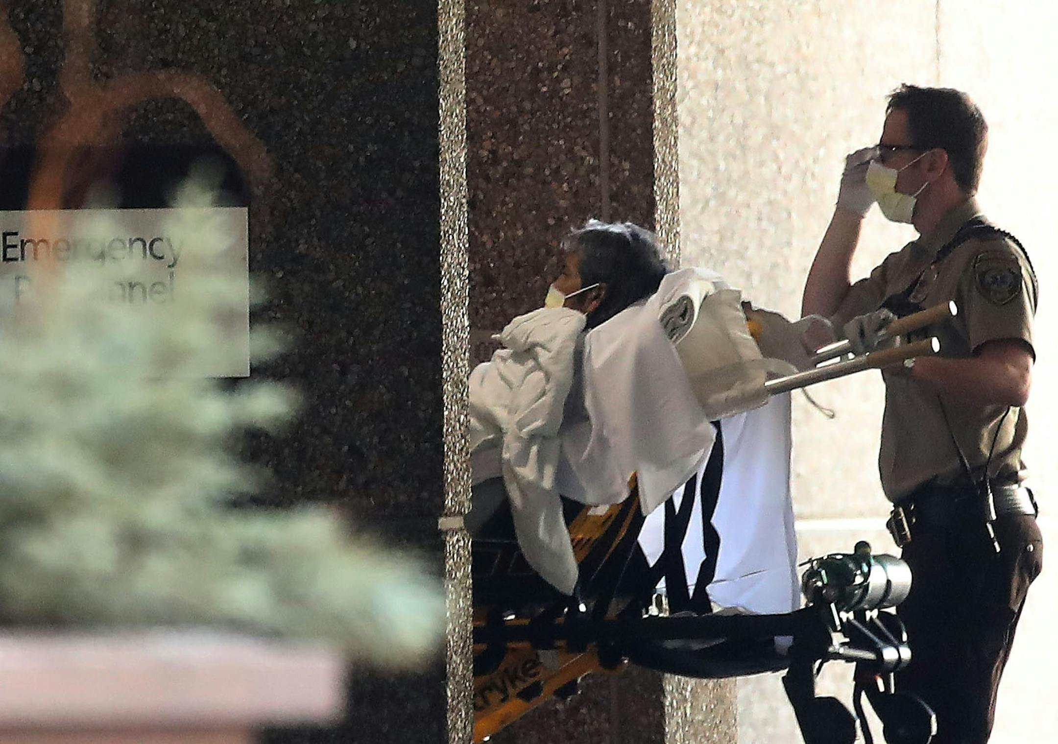 A patient is brought into HCMC emergency by ambulance Thursday, March 26, 2020, in Minneapolis, MN.