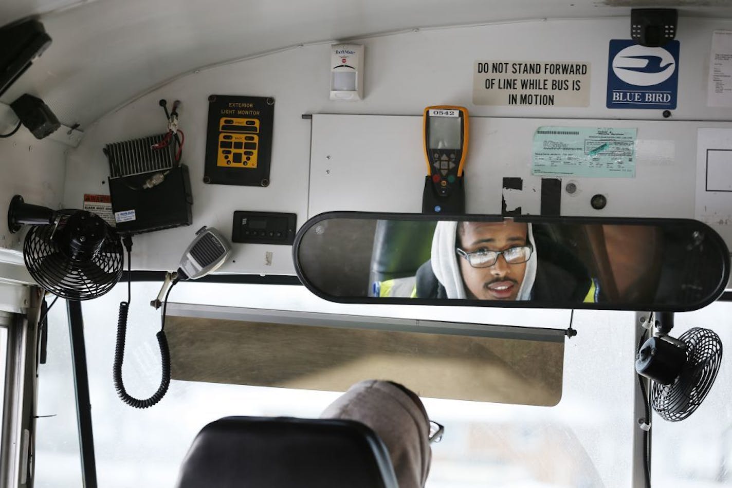 Abdisalan Hassan a bus driver for First Student talked about the 3 cameras on board his bus at Hazel Park Preparatory Academy Monday November 17, 2014. St. Paul, Minnesota.