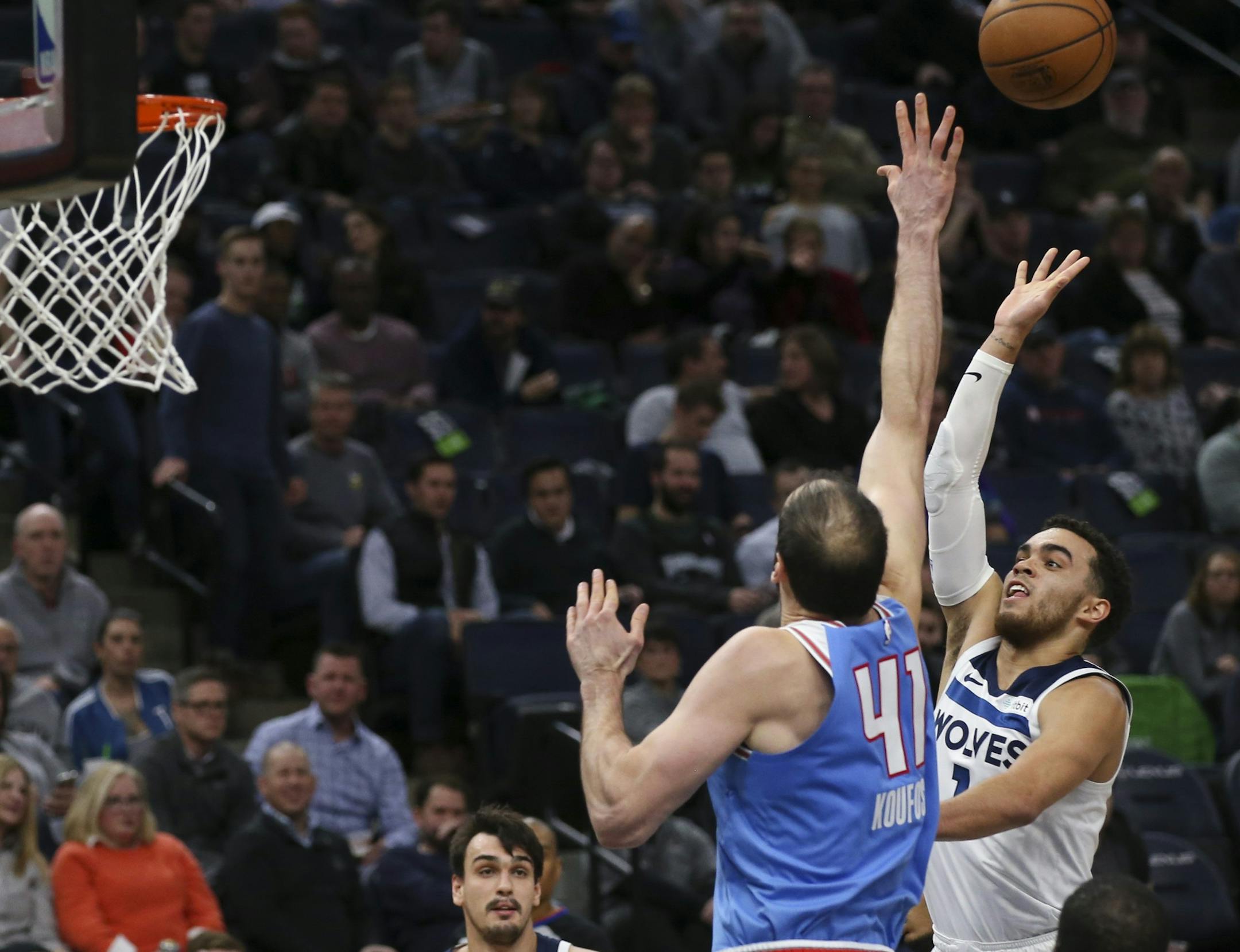 Minnesota Timberwolves guard Tyus Jones (1) put up a second half shot over the defense of Sacramento Kings center Kosta Koufos (41). ] JEFF WHEELER &#xef; jeff.wheeler@startribune.com The Minnesota Timberwolves defeated the Sacramento Kings 132-105 in an NBA basketball game Monday night, December 17, 2018 at Target Center in Minneapolis. ORG XMIT: MIN1812172203421086
