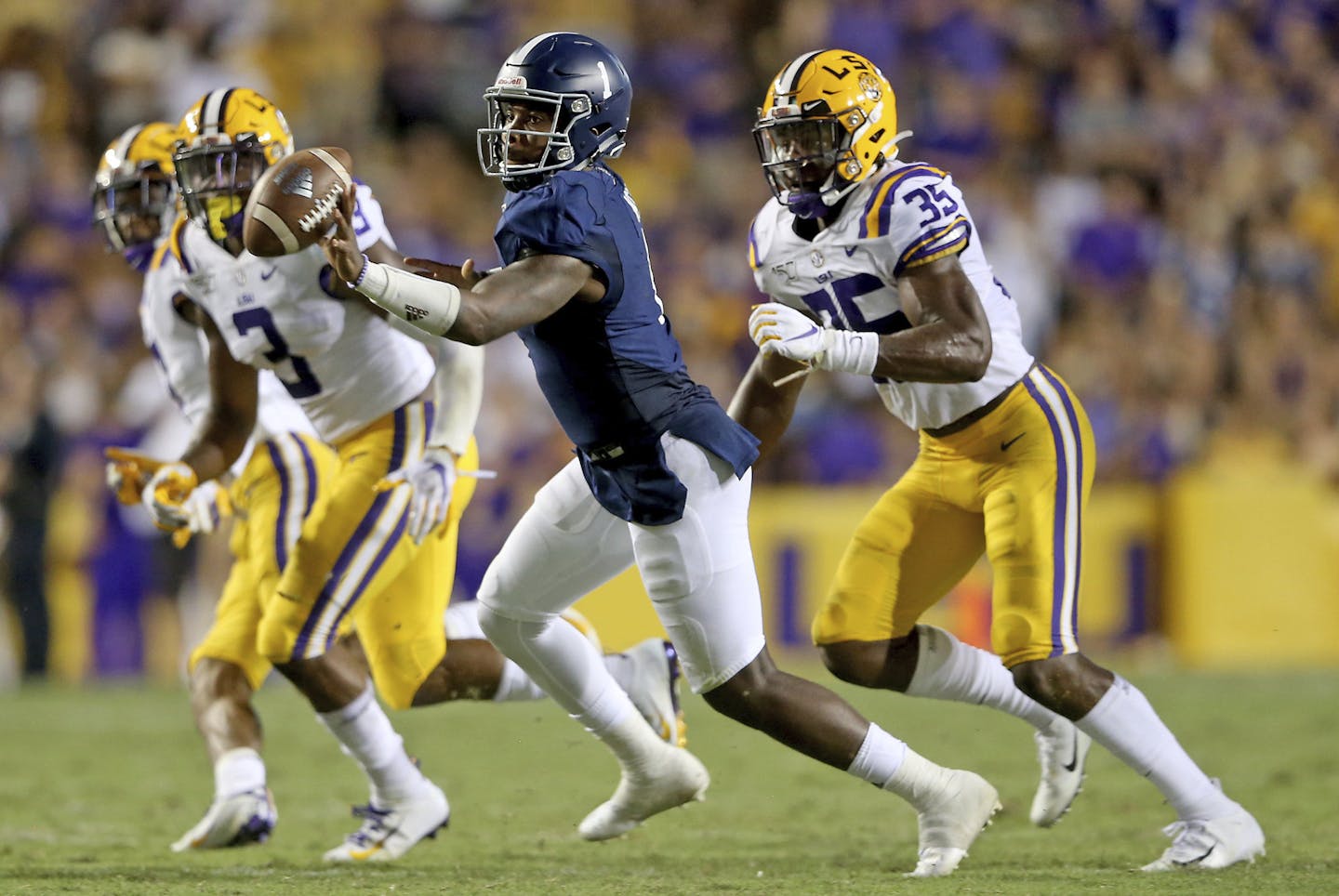 Georgia Southern Eagles quarterback Shai Werts (1) pitches the ball in the second quarter during an NCAA football game between the Georgia Southern Eagles and Louisiana State University Tigers in Baton Rouge, La., Saturday, Aug. 31, 2019. (AP Photo/Michael Democker) ORG XMIT: LAMD149