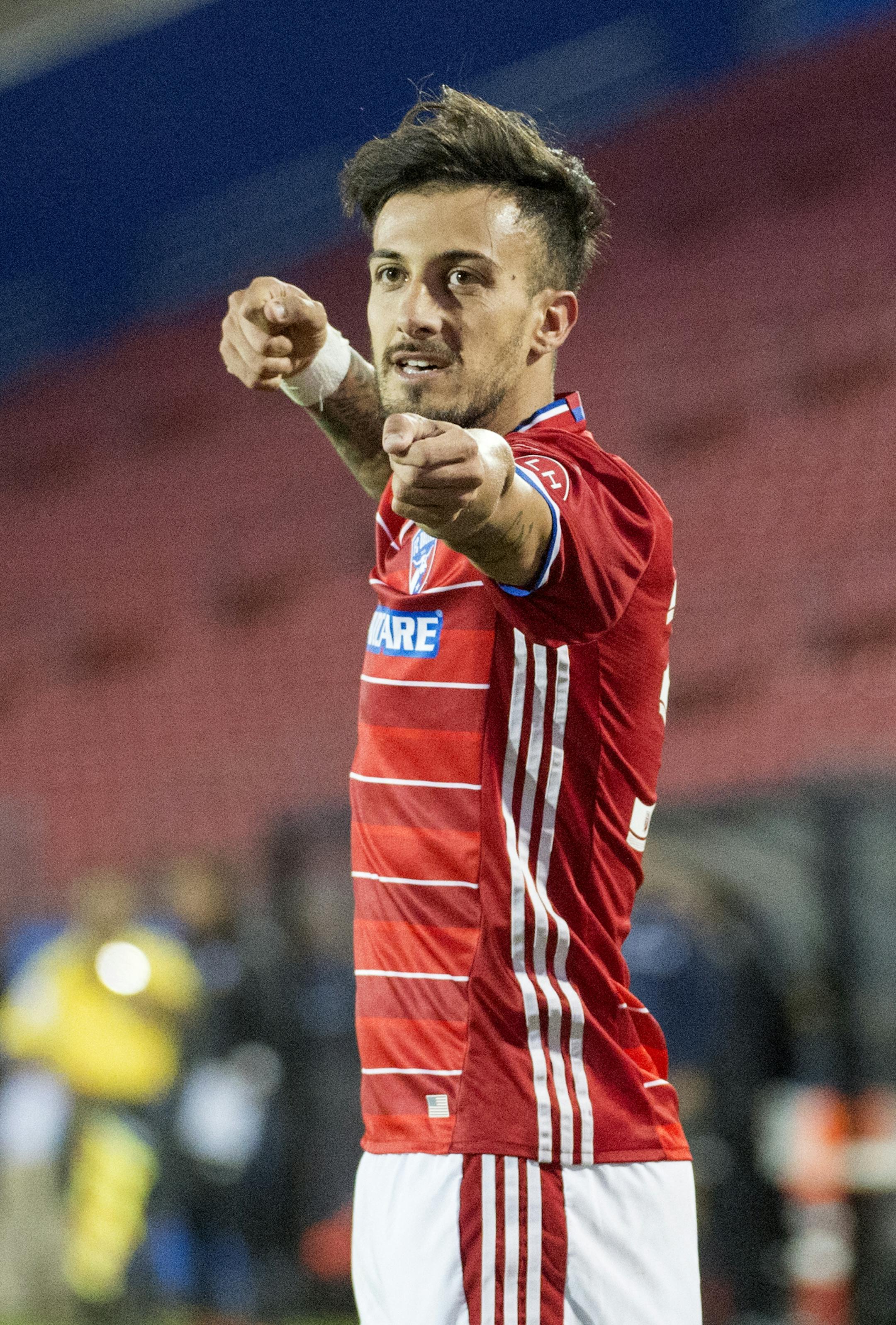 FC Dallas forward Maxi Urruti (37) celebrates after scoring a goal against Pachuca near the end of the first half of a CONCACAF Champions League semifinal soccer game, Wednesday, March 15, 2017 in Frisco, Texas. FC Dallas won 2-1. (AP Photo/Jeffrey McWhorter)