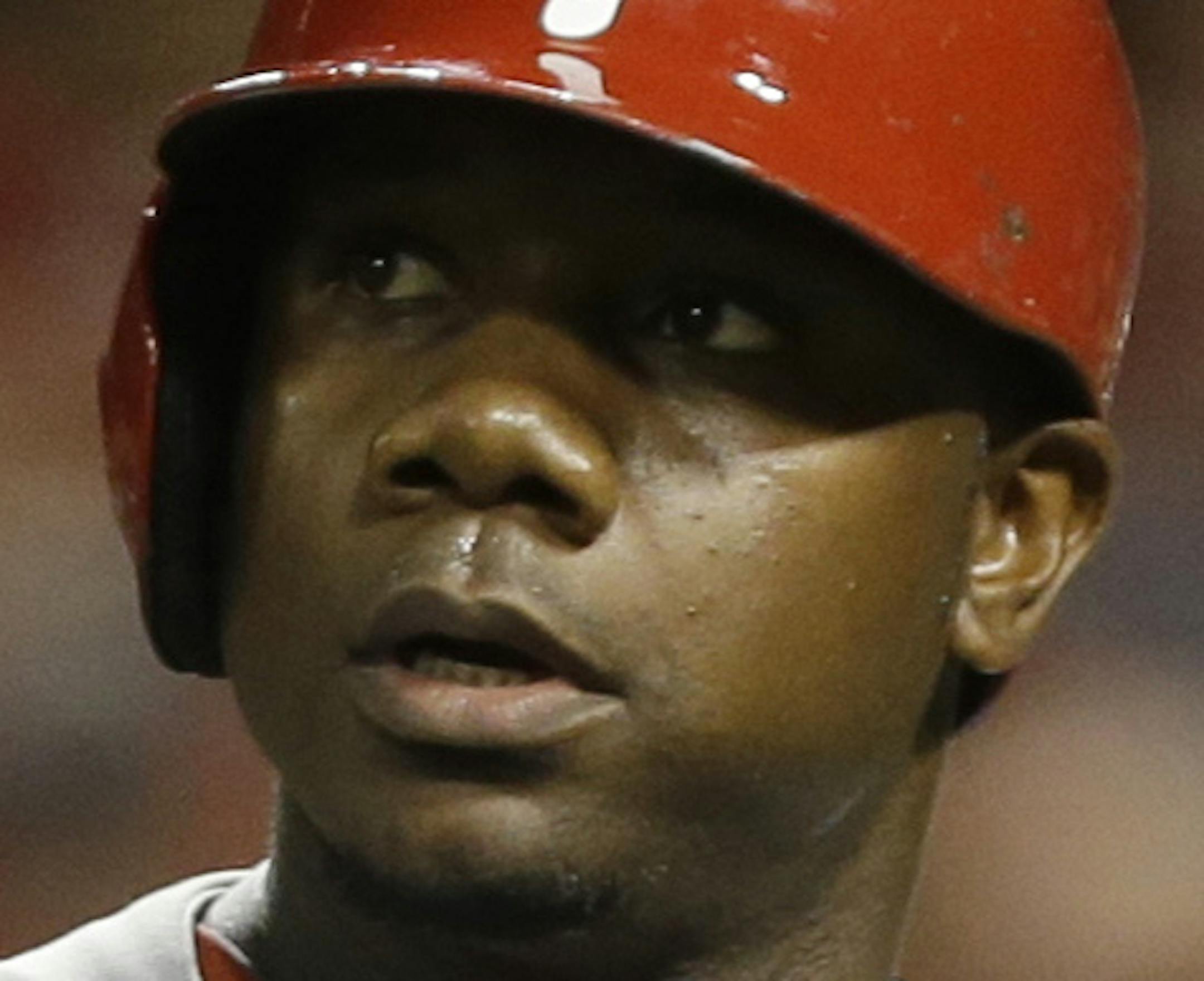 Philadelphia Phillies' Ryan Howard walks off the field after striking out against the Cincinnati Reds in a baseball game, Wednesday, April 17, 2013, in Cincinnati. (AP Photo/Al Behrman) ORG XMIT: NYOTK