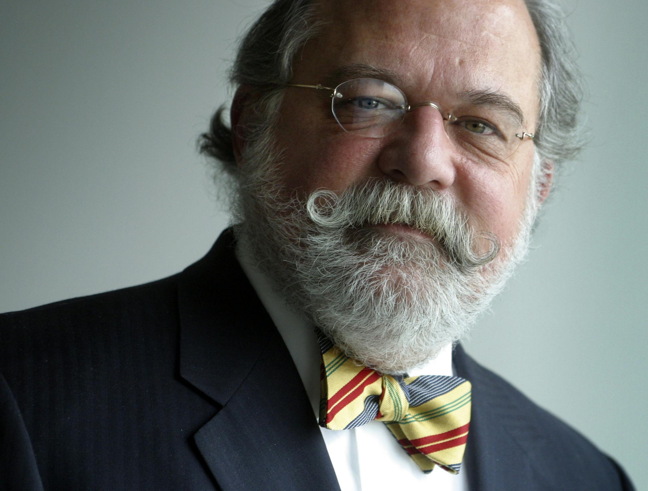 In this Jan. 16, 2004 photo, attorney Ty Cobb poses in the offices of his former law firm, Hogan & Hartson, in Denver.