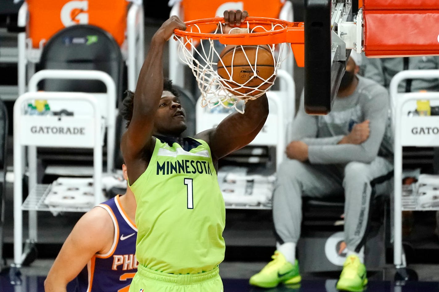 Minnesota Timberwolves forward Anthony Edwards (1) dunks against the Phoenix Suns during the first half of an NBA basketball game Thursday, March 18, 2021, in Phoenix. (AP Photo/Rick Scuteri)