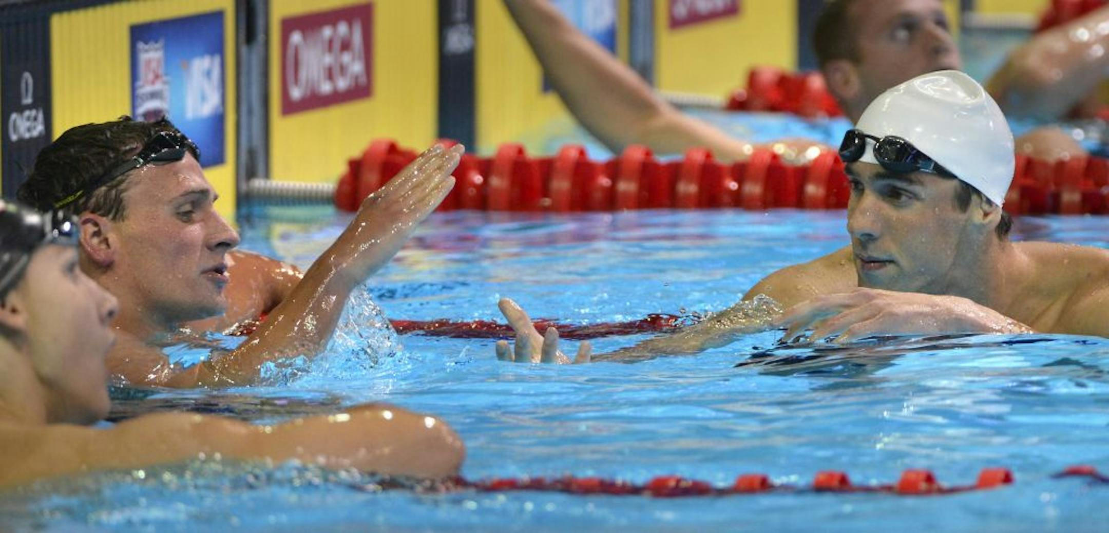 Michael Phelps reached out to Ryan Lochte (left) to shake hands after Lochte beat Phelps in the 400 meter Individual Medley Monday night.