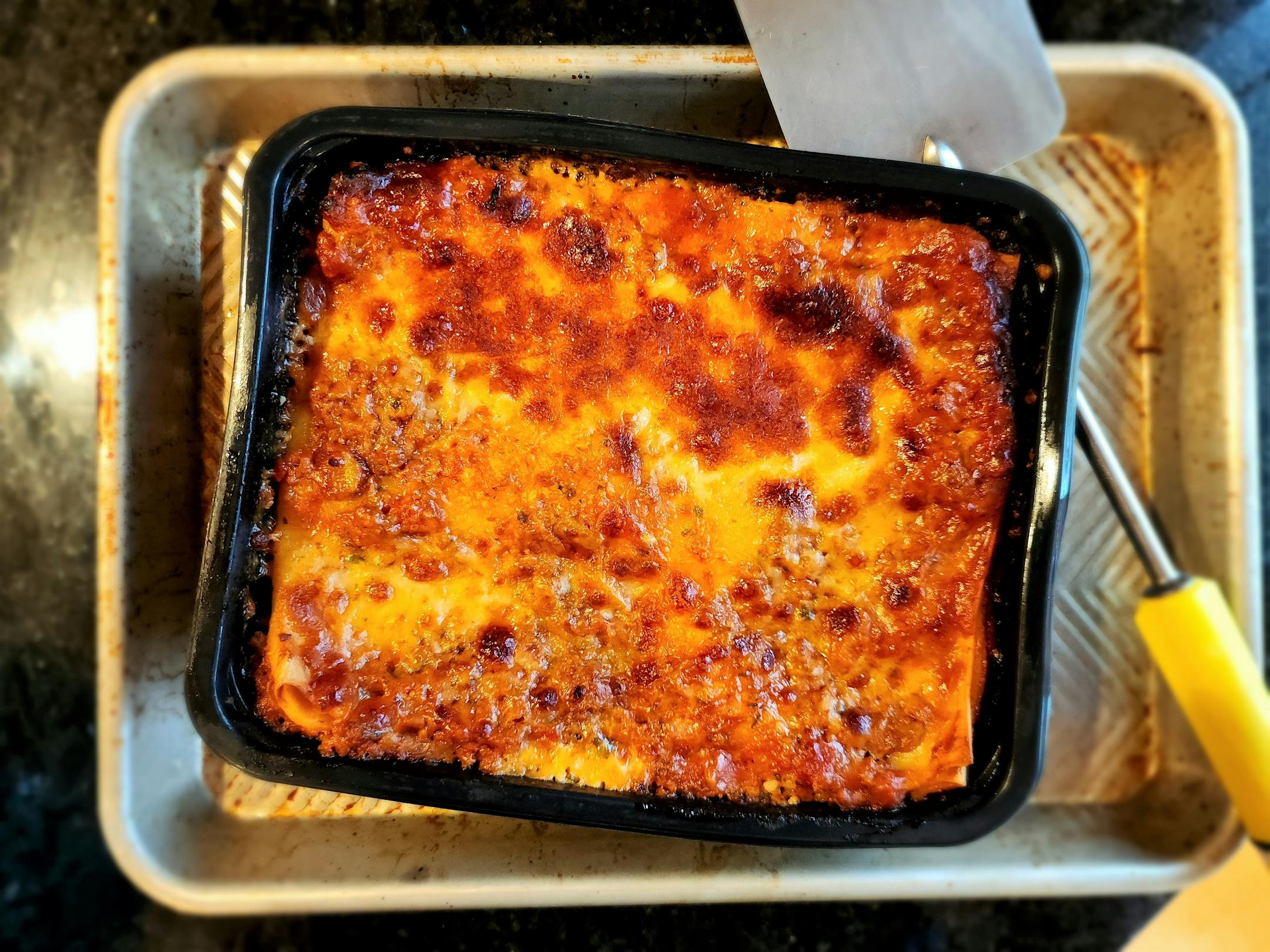 Frozen lasagna baked on a pan