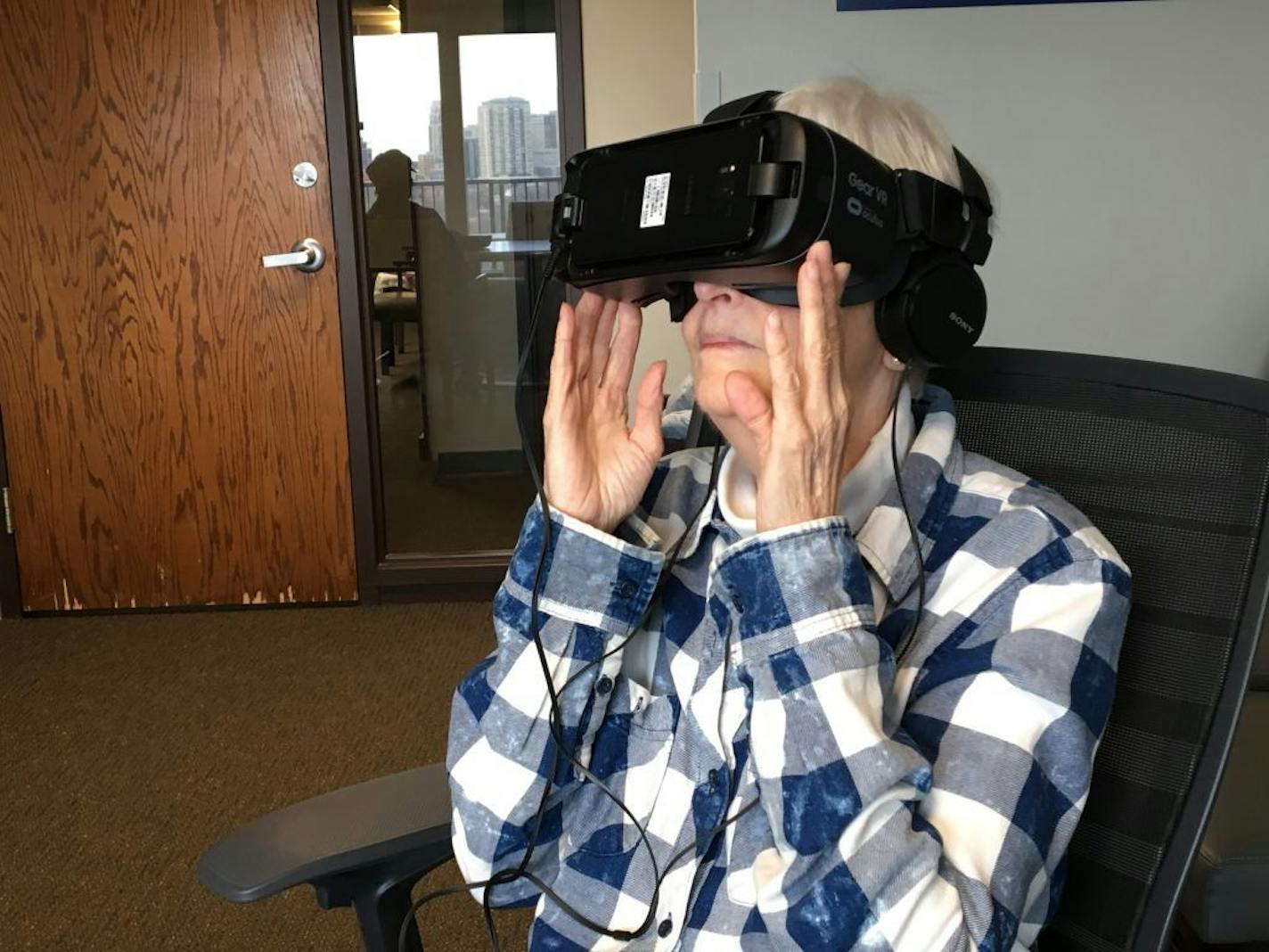 Ebenezer resident Bonnie Clark, 77, said viewing locations like Stonehenge through a virtual reality headset makes her feel like she's really there. "I don't notice any aches and pains" while using the device, she said.