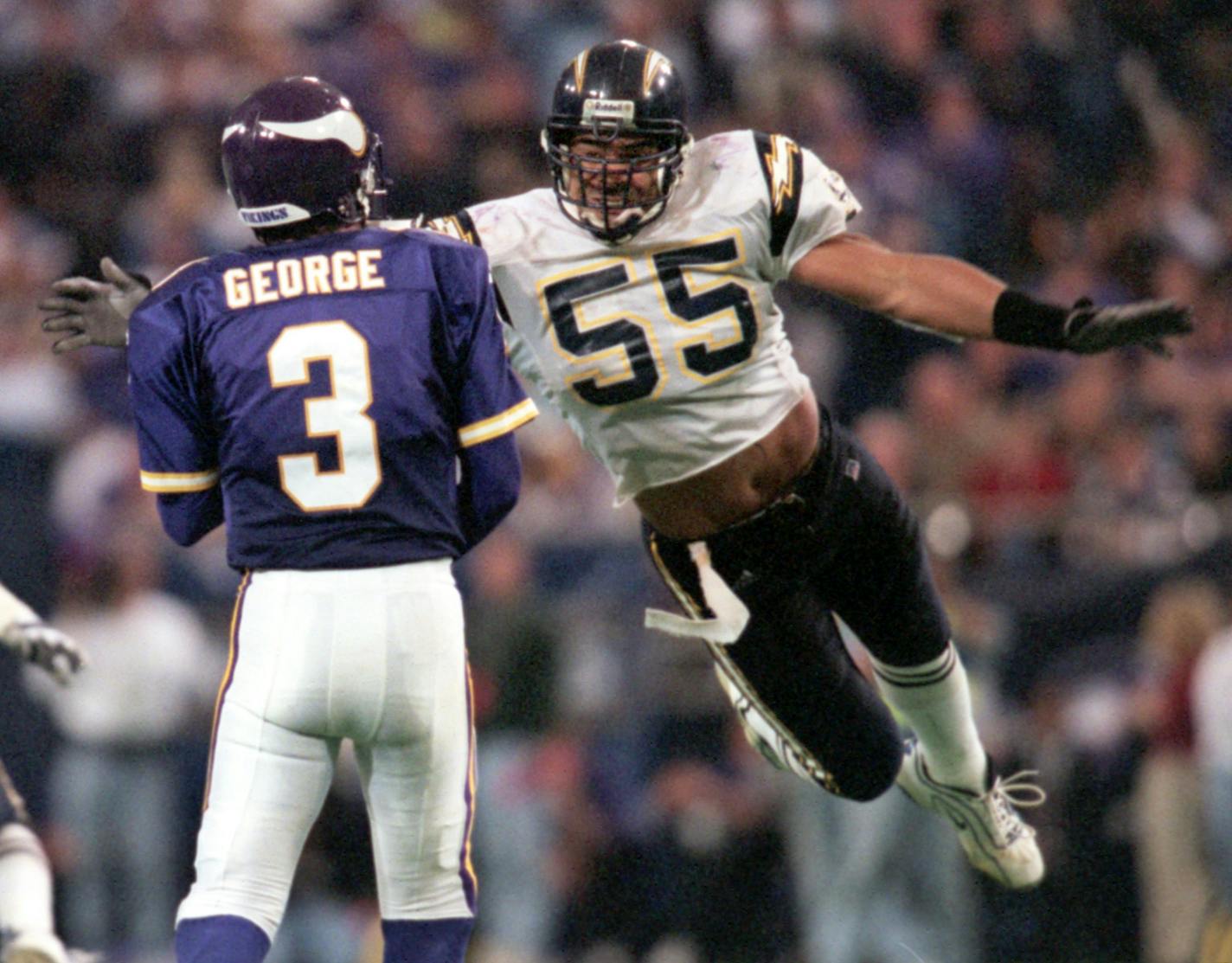 Vikings vs. San Diego Chargers November 28, 1999 -- San Diego Chargers linebacker Junior Seau, #55, tries to get to Minnesota Viking quarterback Jeff George in the fourth quarter. The Vikings beat the Chargers by a final score of 35-27 on Sunday in The Metrodome in Minneapolis, MN.