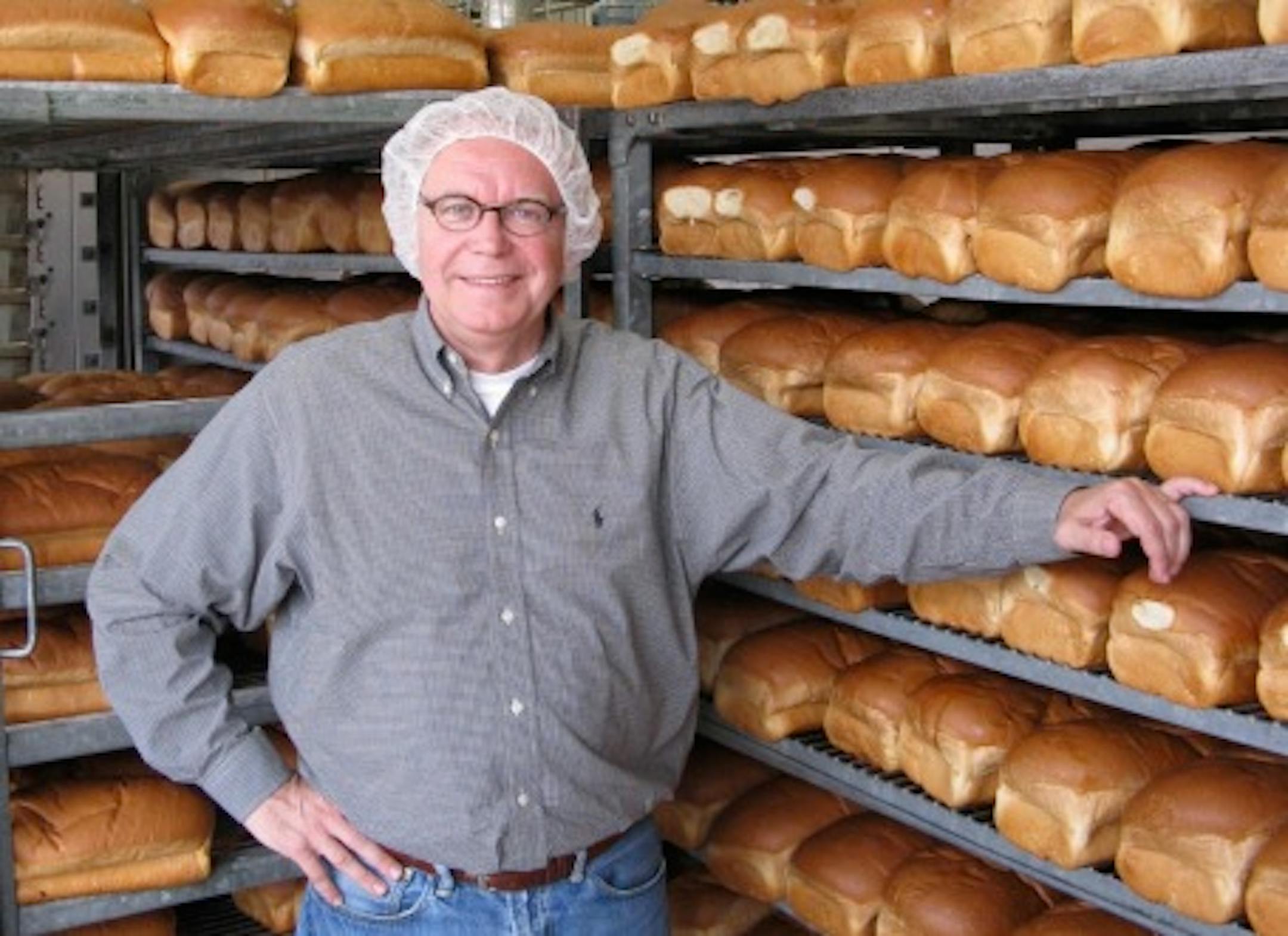 Wayne Kostroski (and requisite hairnet), inside his busy Franklin Street Bakery in Minneapolis